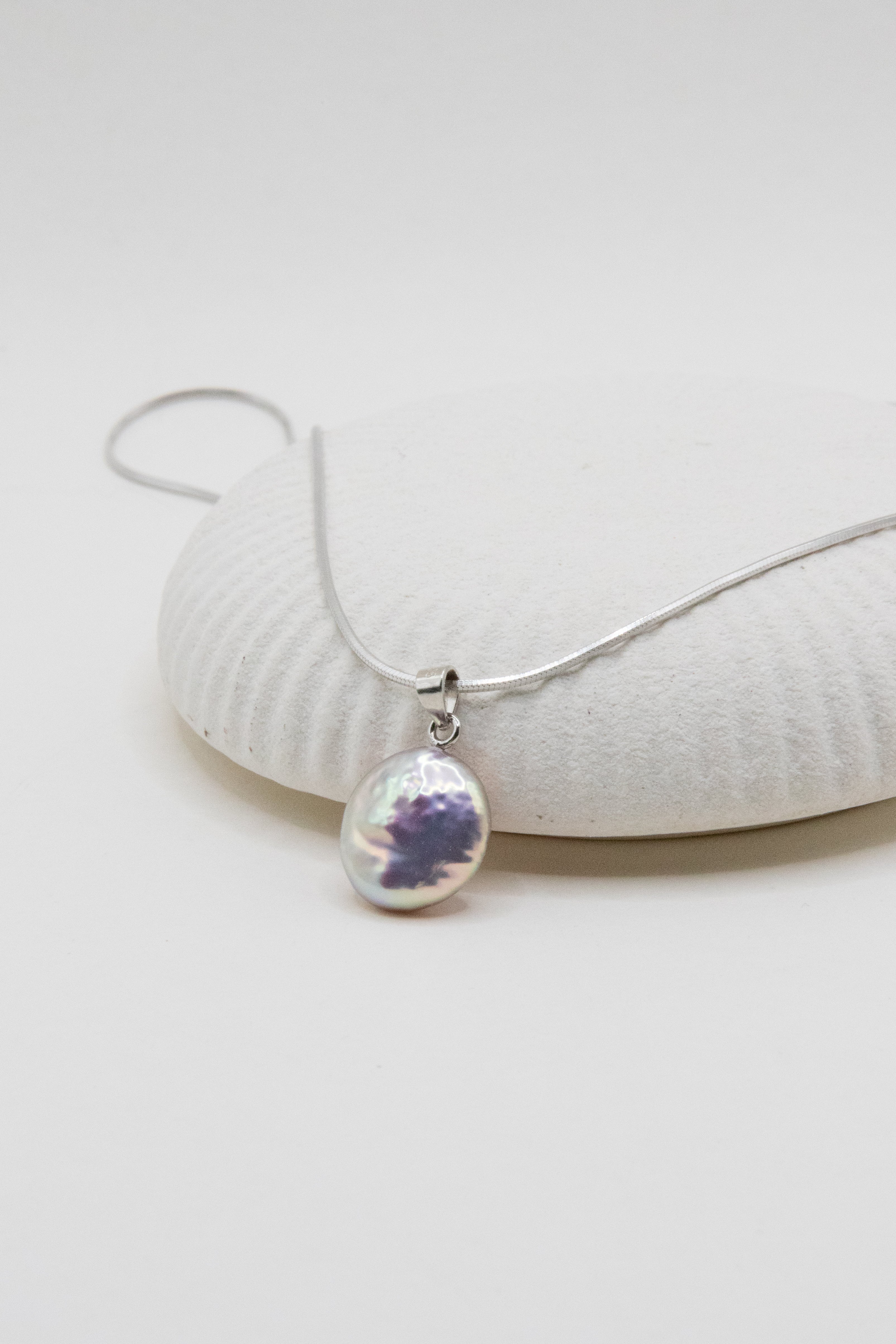 Shinier than silver- flawless freshwater button pearl necklace.