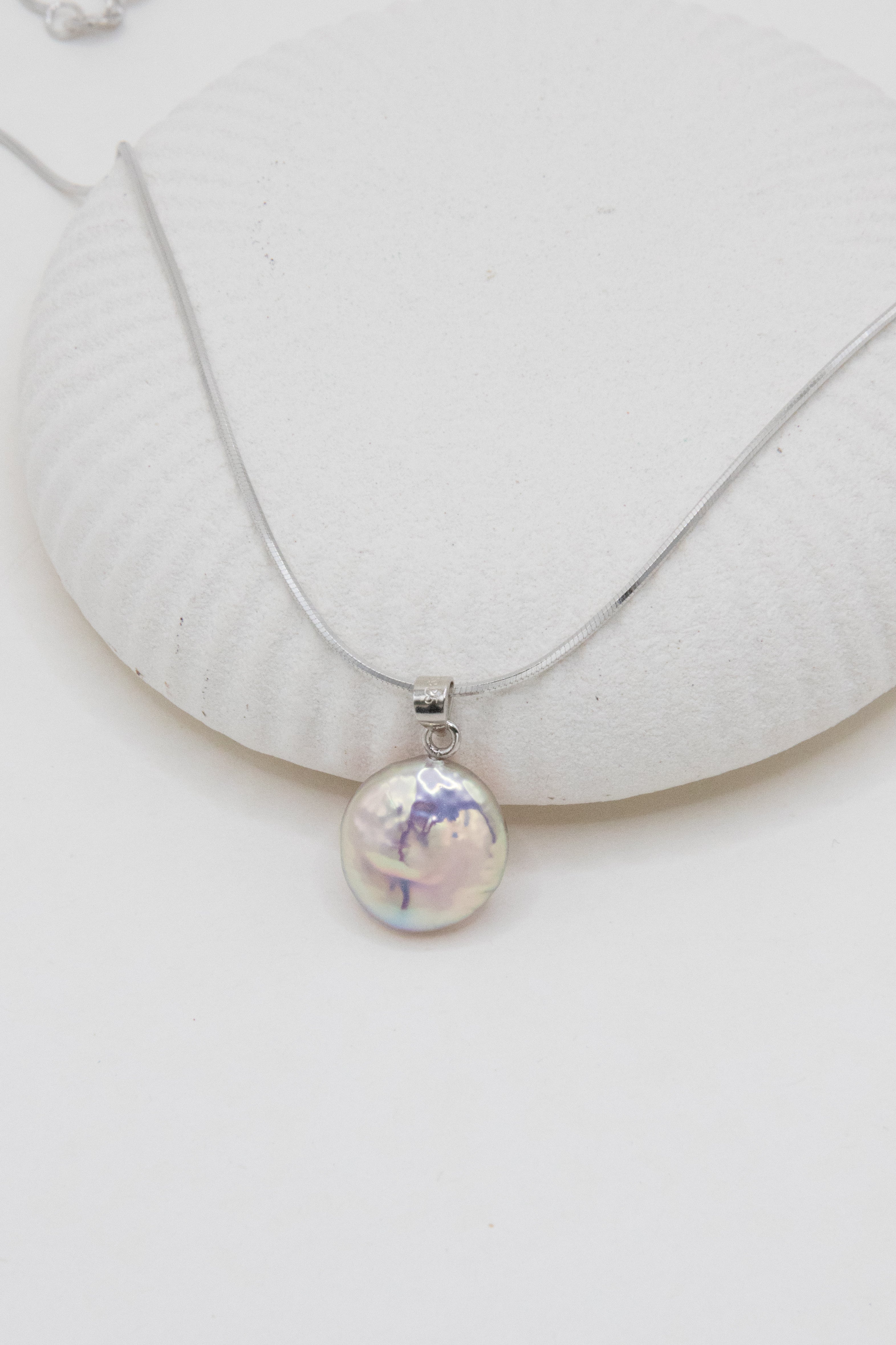 Shinier than silver- flawless freshwater button pearl necklace.