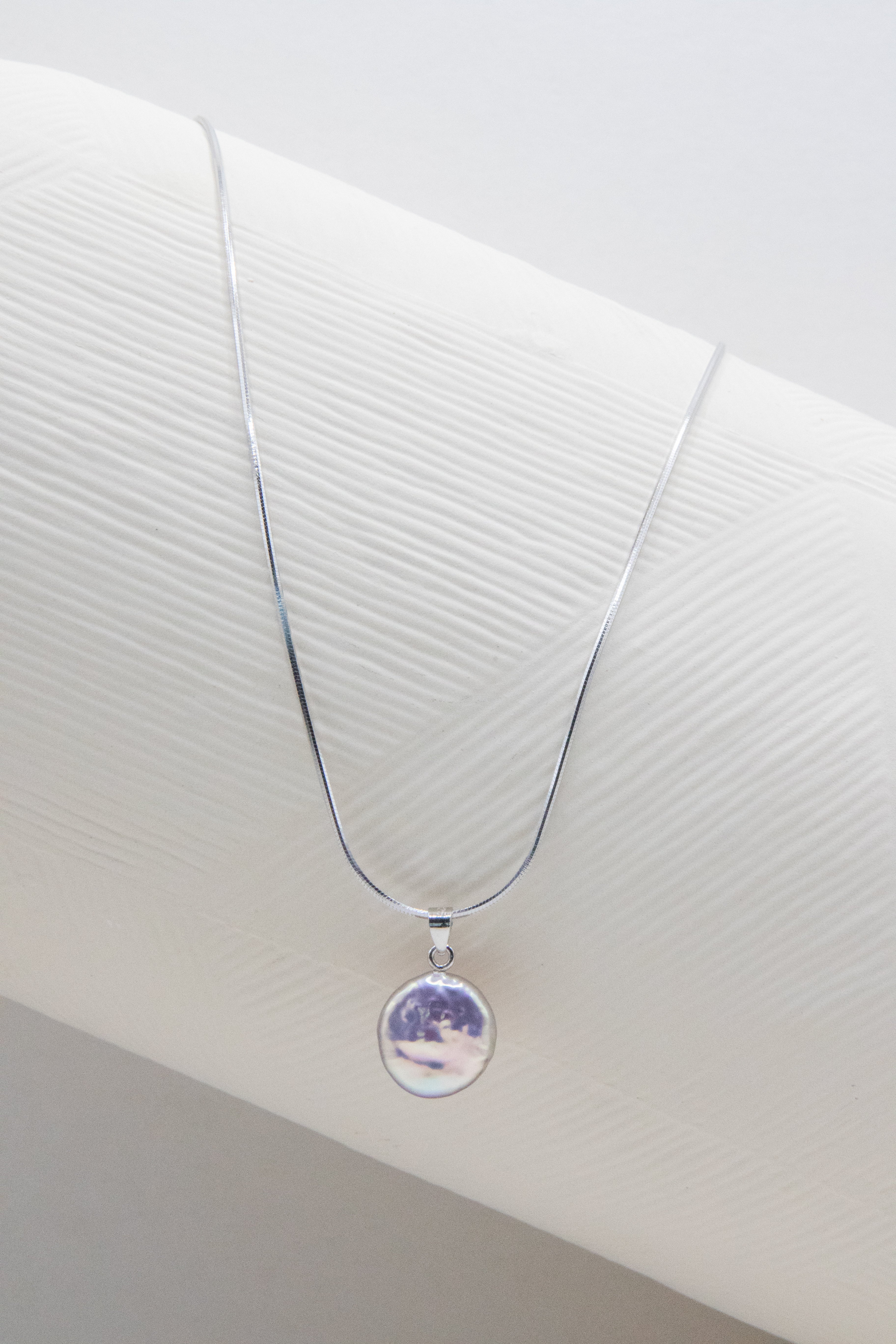 Shinier than silver- flawless freshwater button pearl necklace.