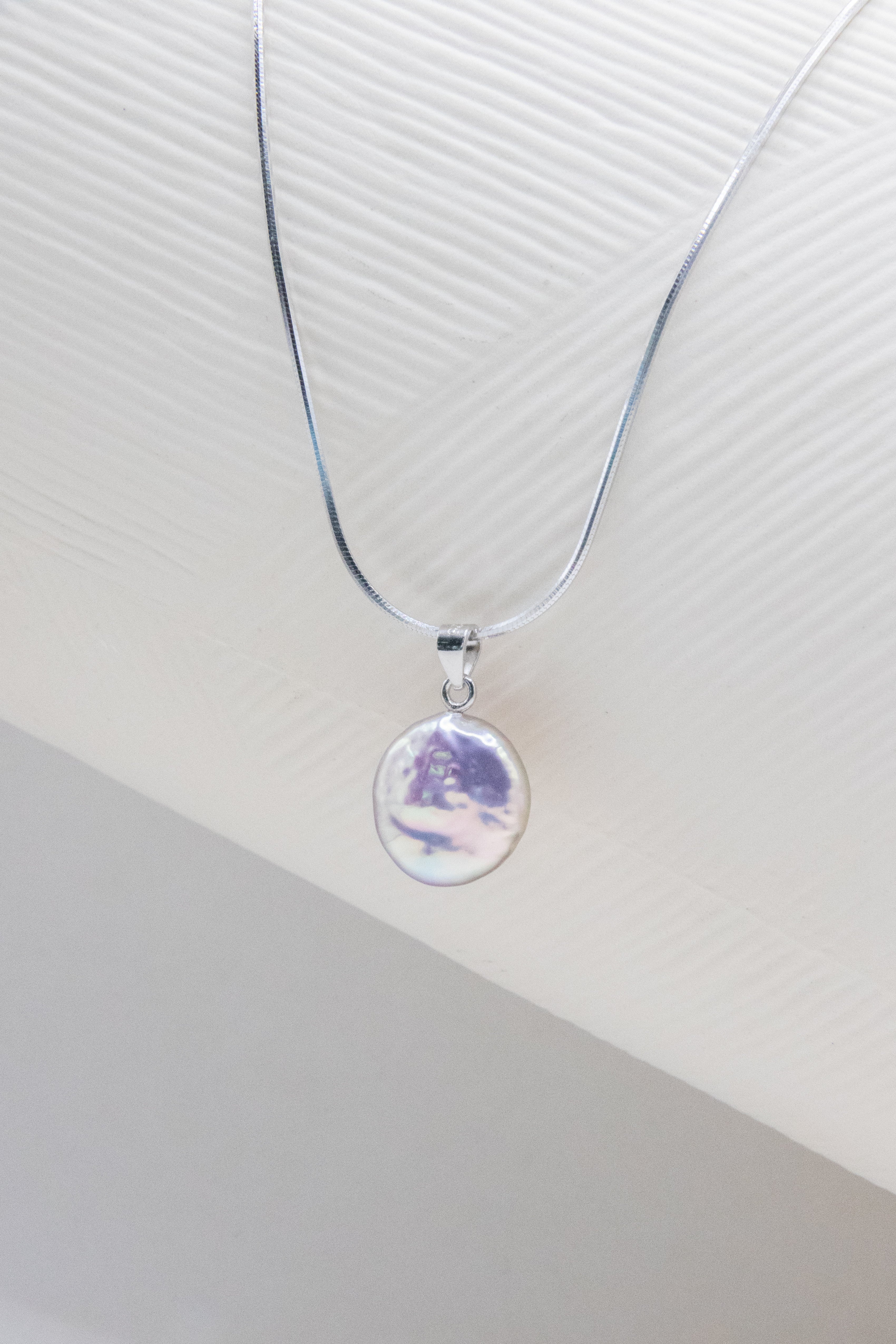 Shinier than silver- flawless freshwater button pearl necklace.