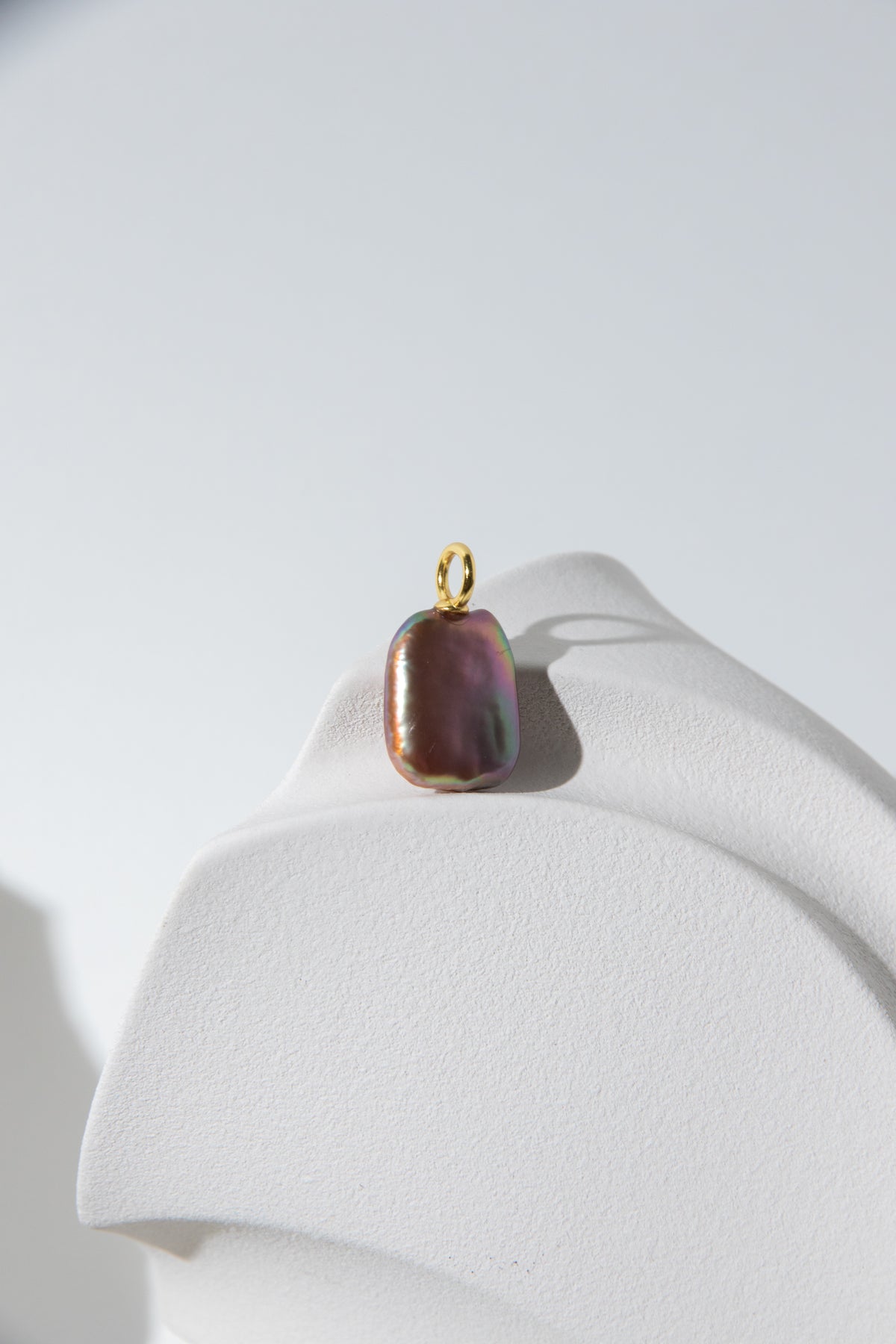 Strong thick brown based vivid green and purple square pearl pendant.