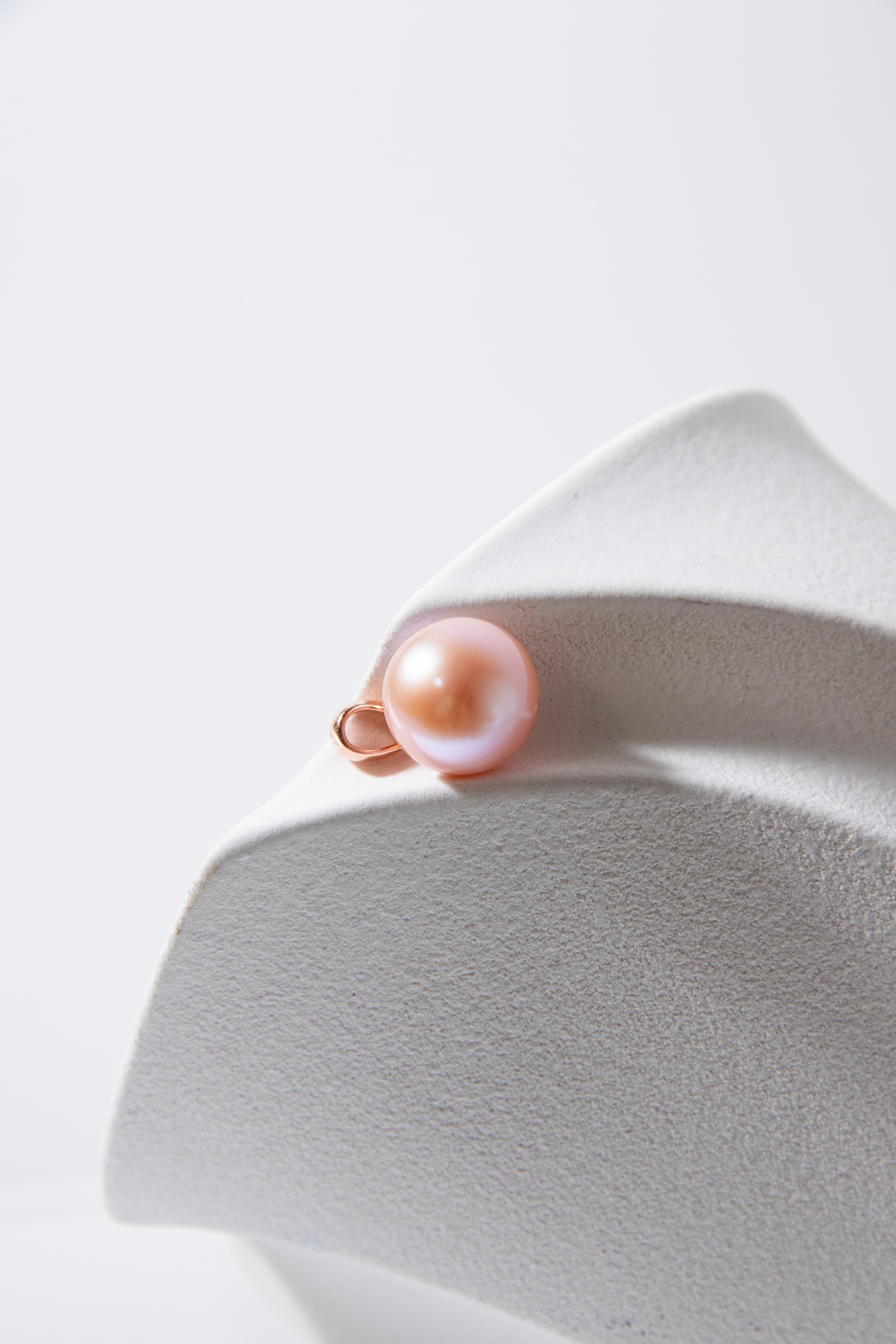 Excellent collection levle perfect round natural pink pearl-rose gold bail.