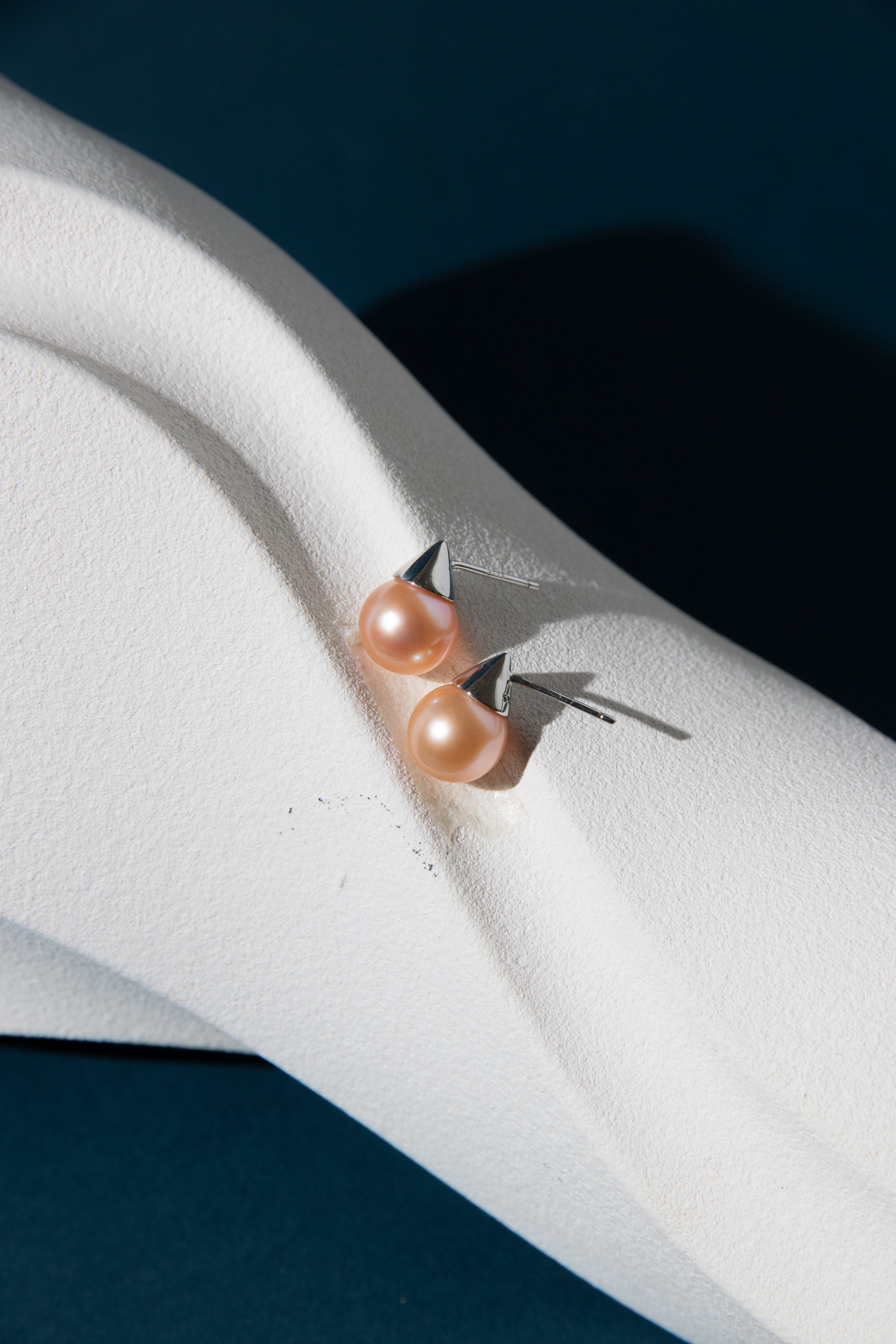 vivid natural orange round pearl with silver ear studs