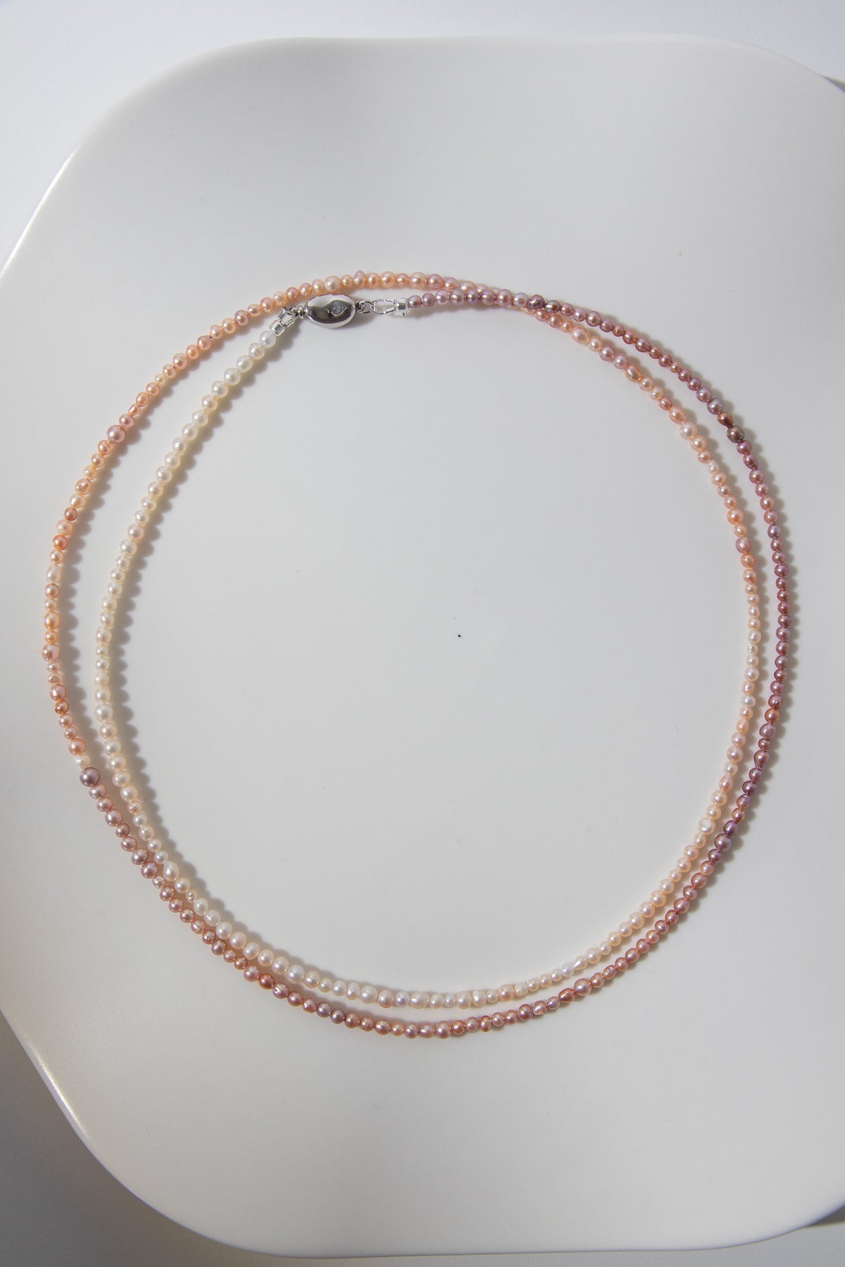 Long mini caviar sized rainbow pearl necklace