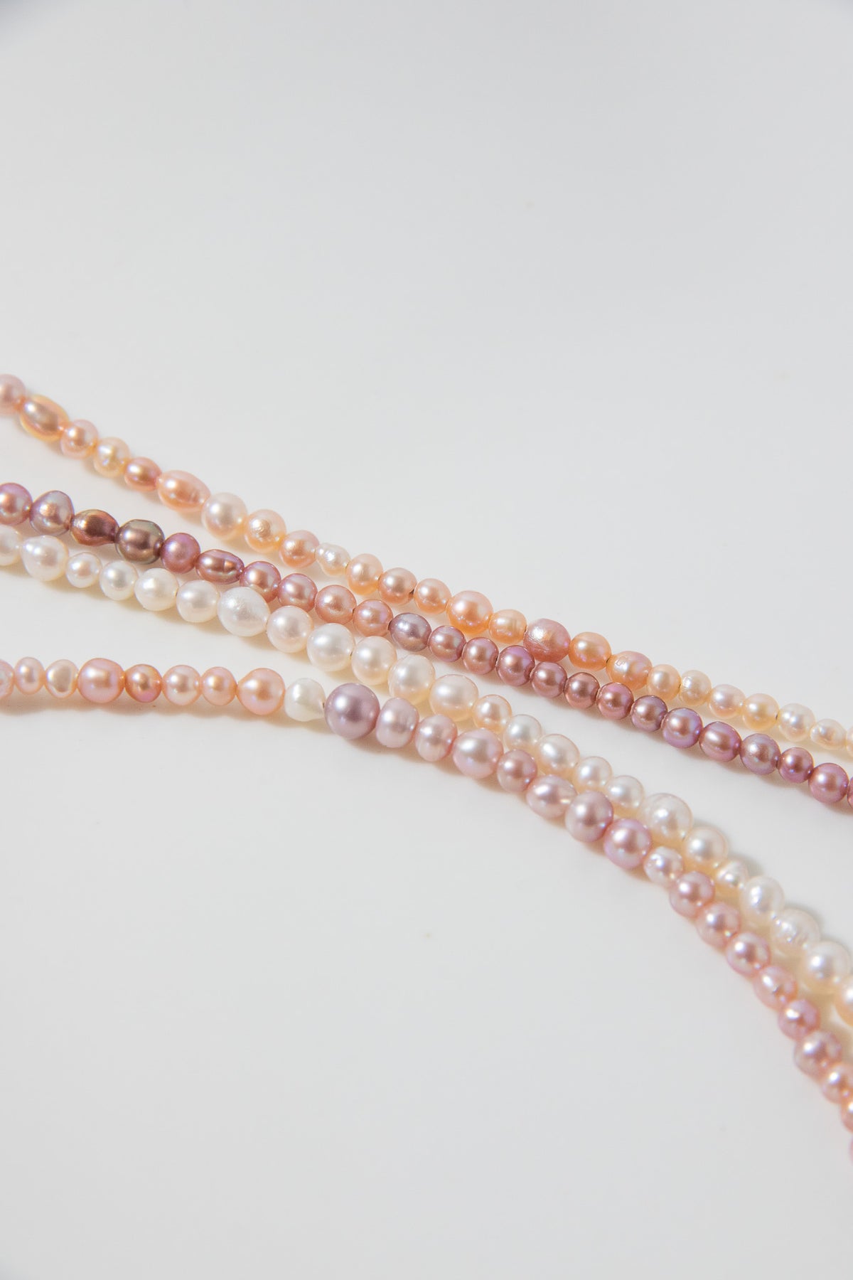 Long mini caviar sized rainbow pearl necklace