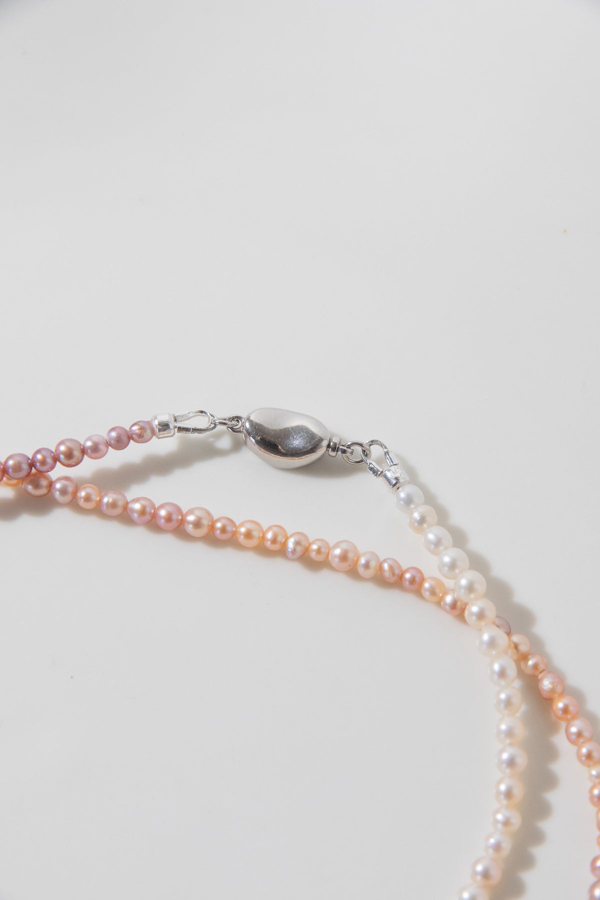 Long mini caviar sized rainbow pearl necklace