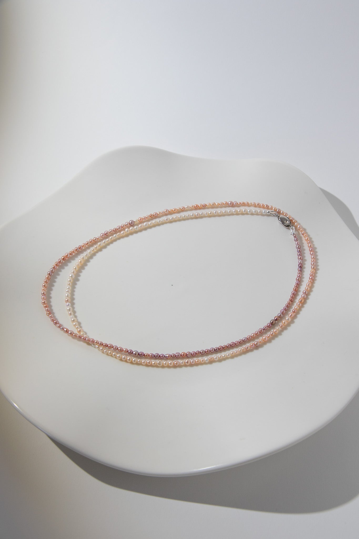 Long mini caviar sized rainbow pearl necklace
