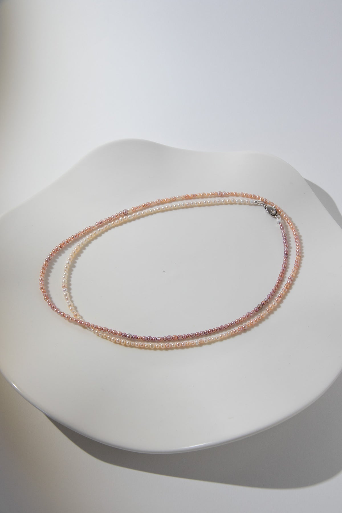 Long mini caviar sized rainbow pearl necklace