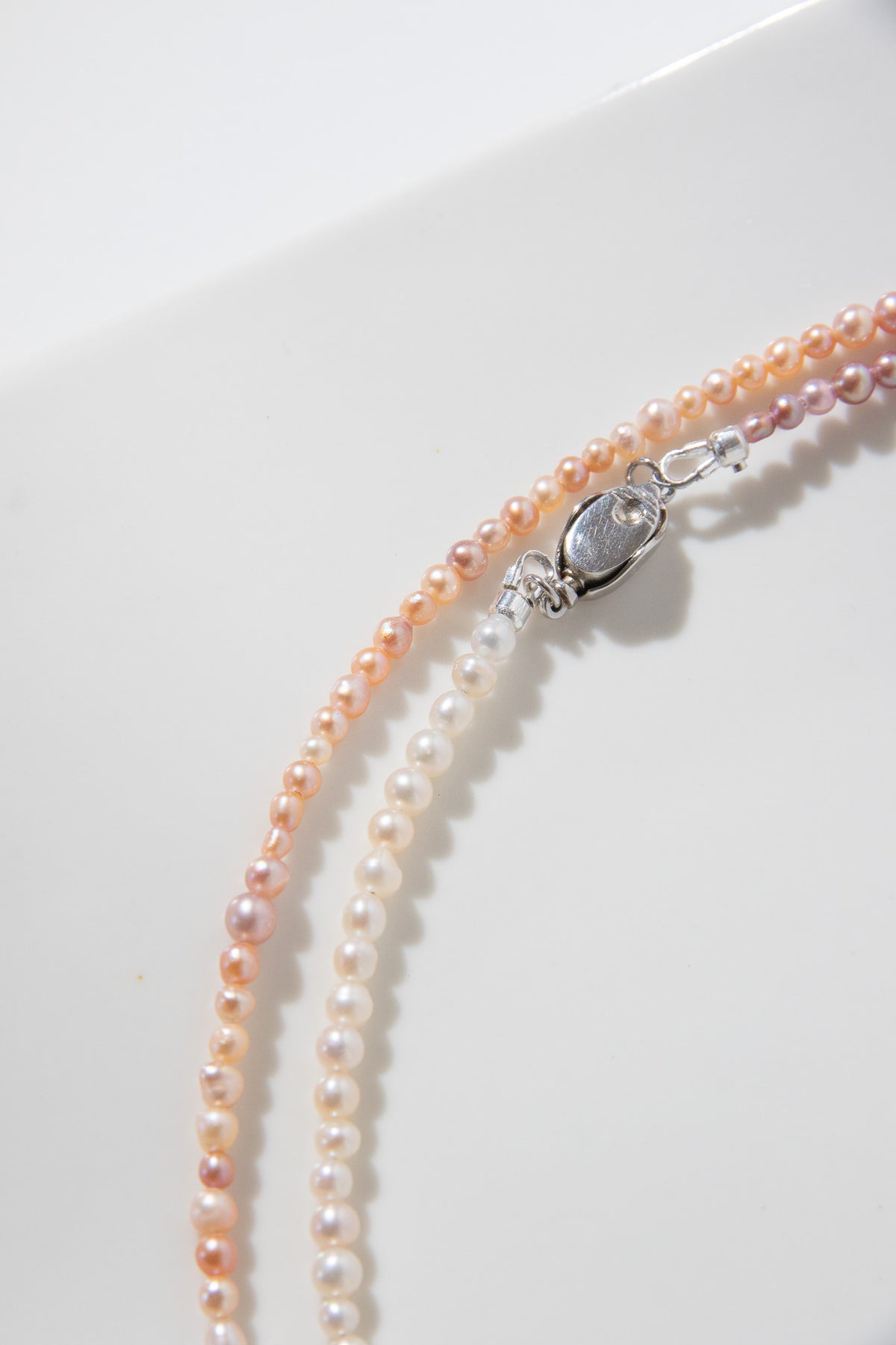 Long mini caviar sized rainbow pearl necklace