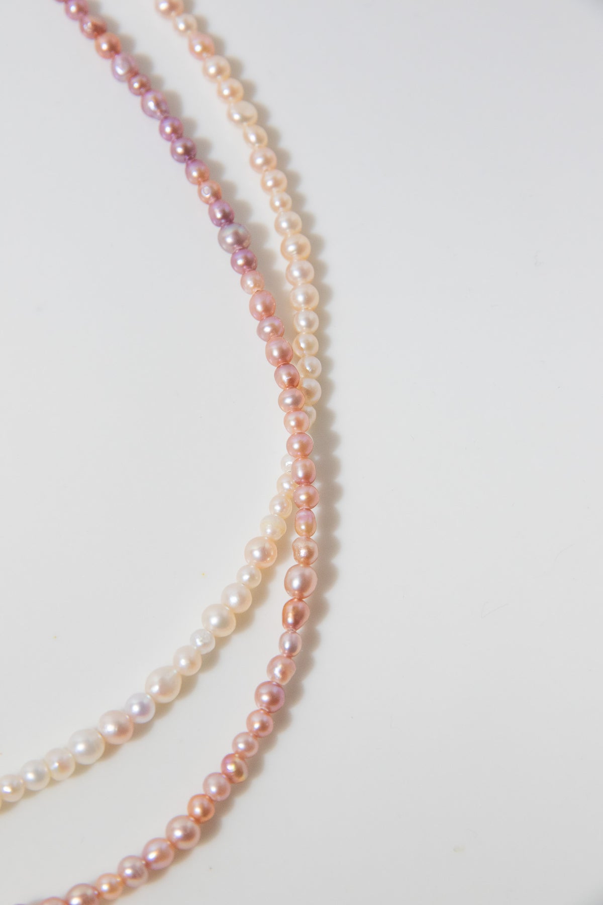 Long mini caviar sized rainbow pearl necklace