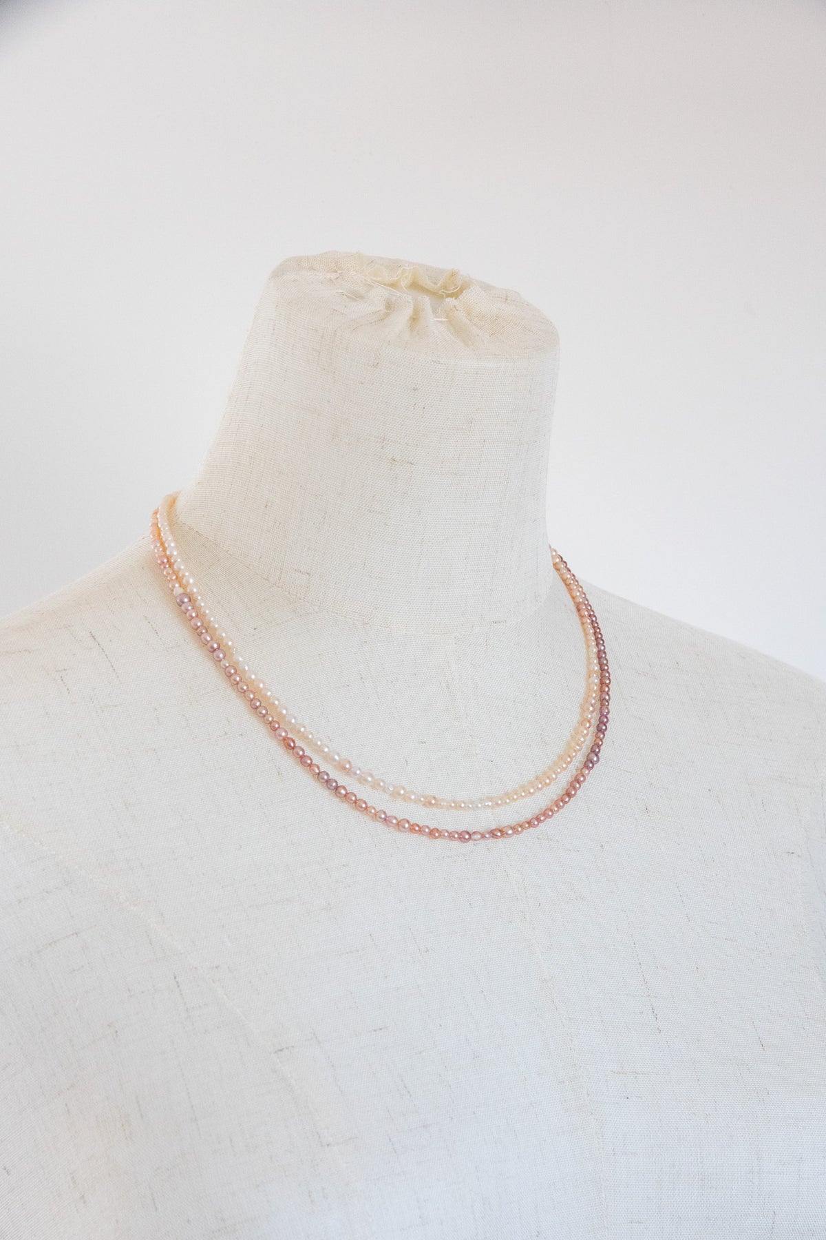 Long mini caviar sized rainbow pearl necklace