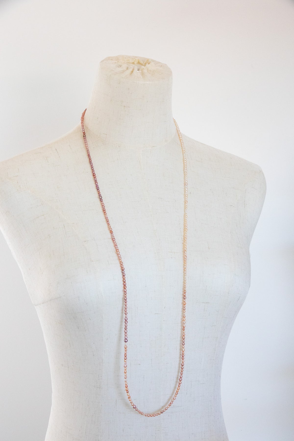 Long mini caviar sized rainbow pearl necklace