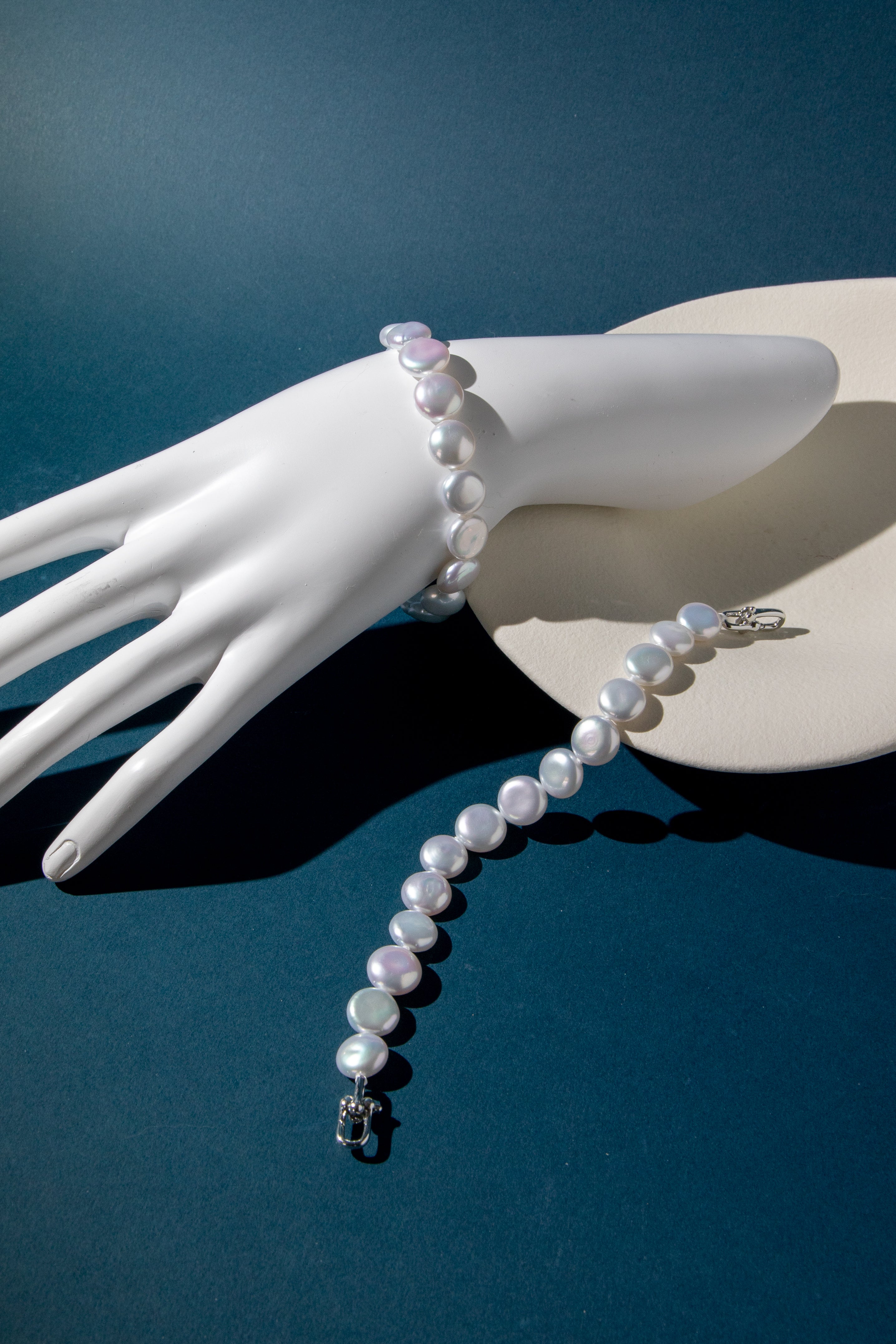 Top excellent level smooth flat button pearls in shiny standard white bracelets.