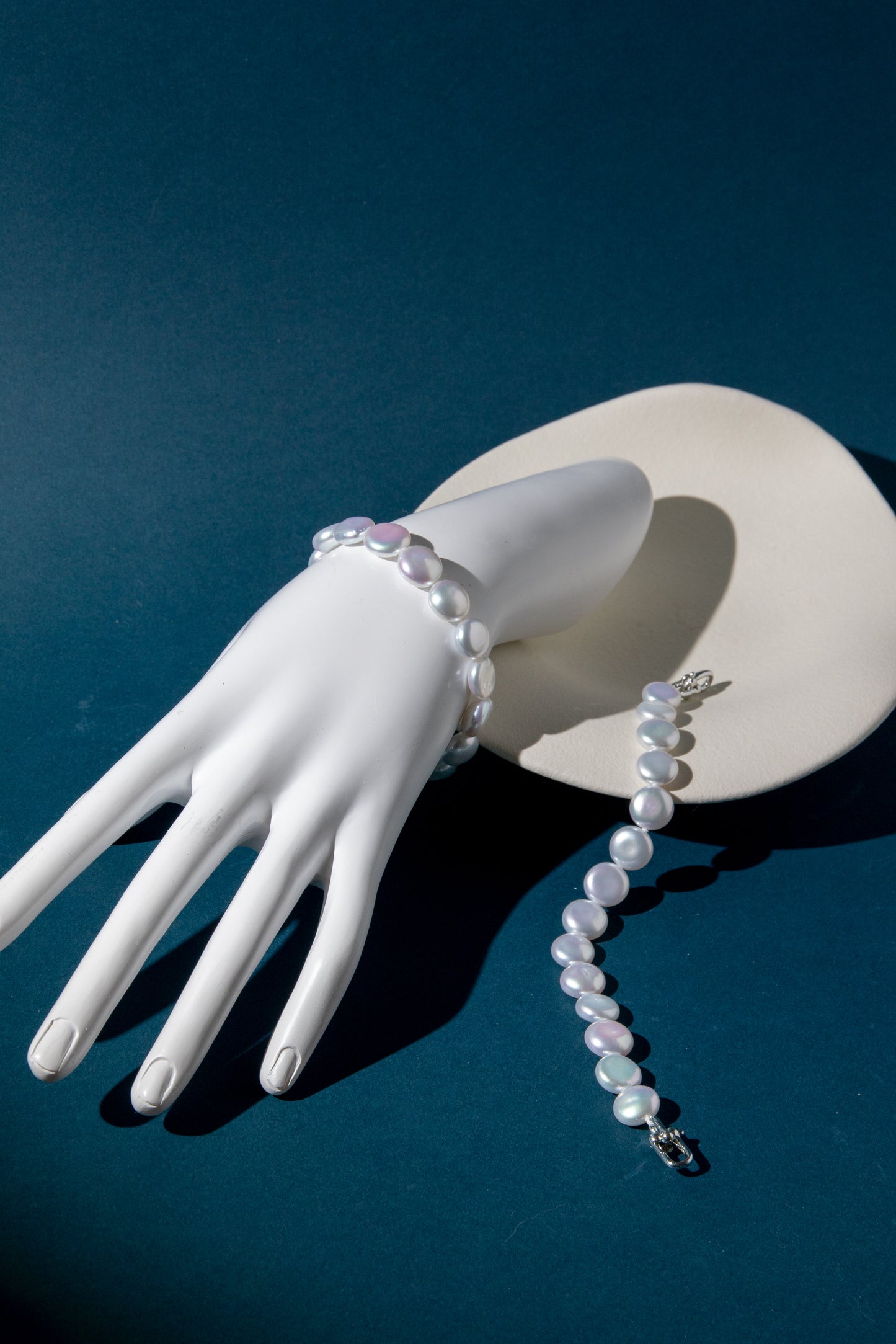 Top excellent level smooth flat button pearls in shiny standard white bracelets.