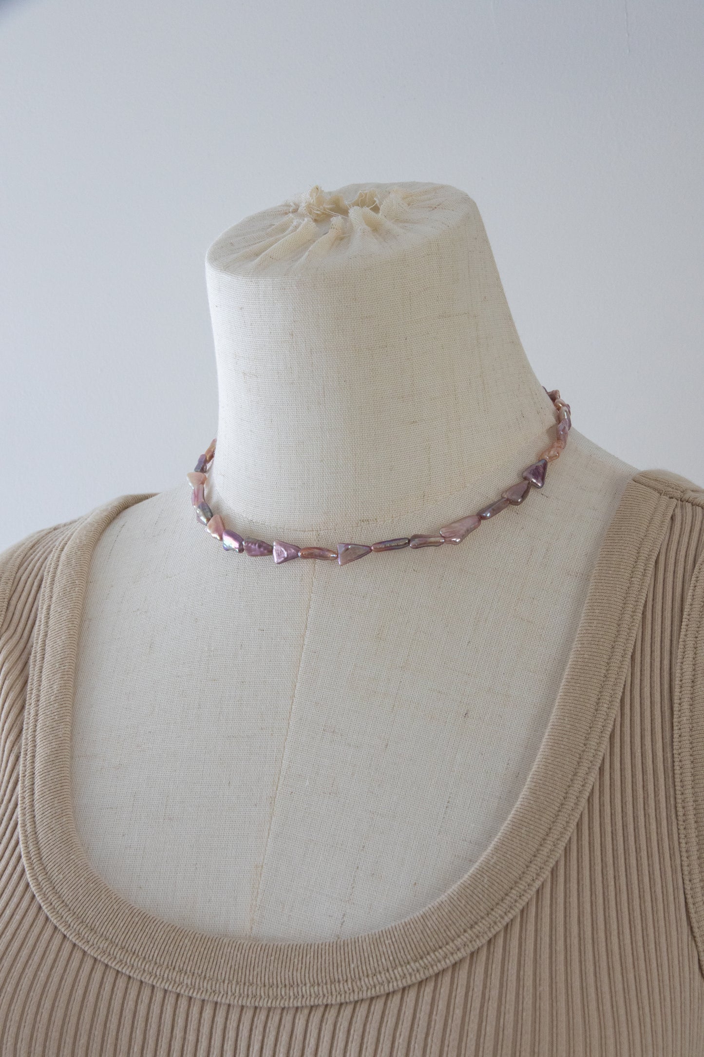 Direction pearl necklace-natural purple colored triangle pearls in silver/ gold plated silverclasps.