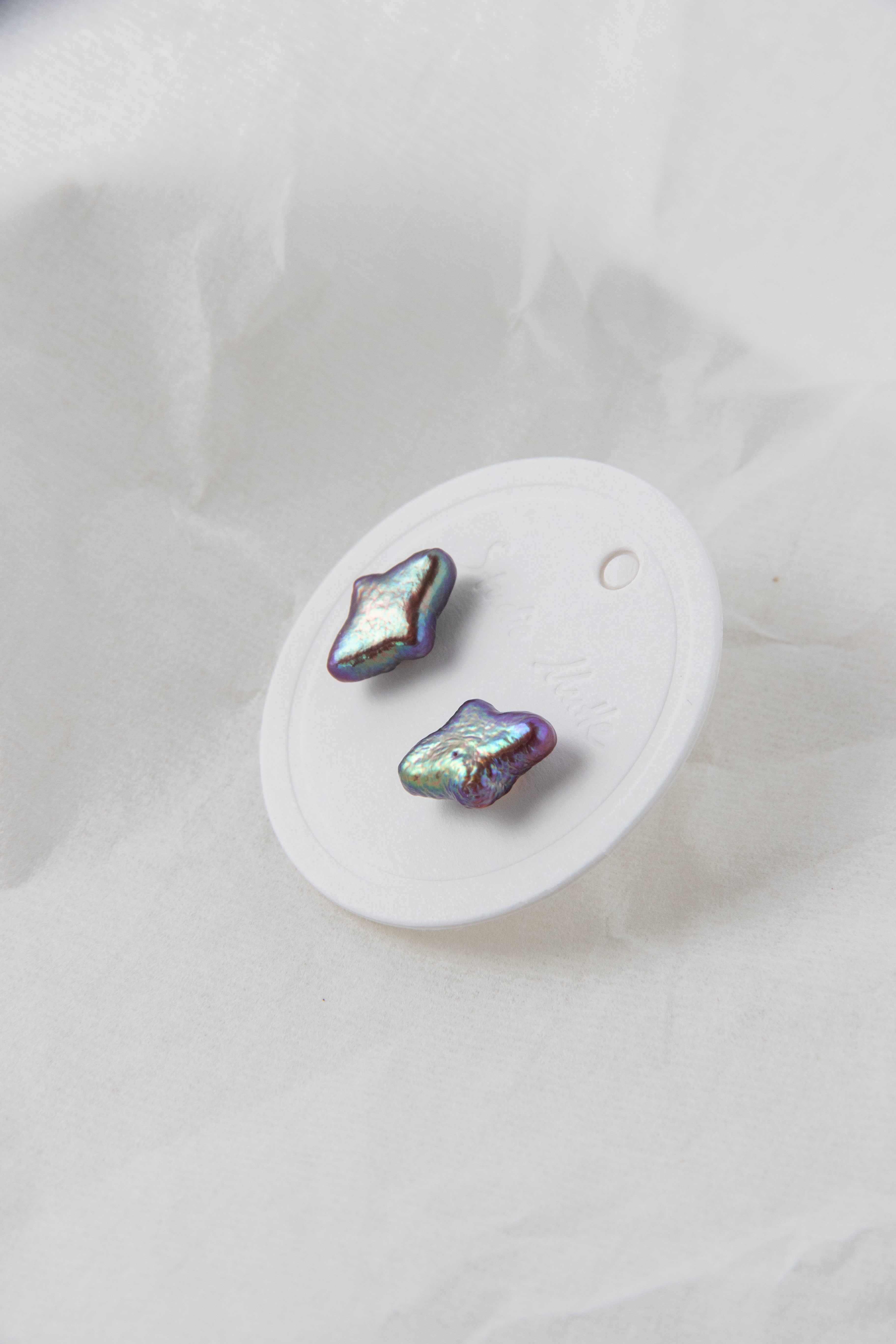 Polar star shaped vivid aurora purple colored pearl studs-NR.1