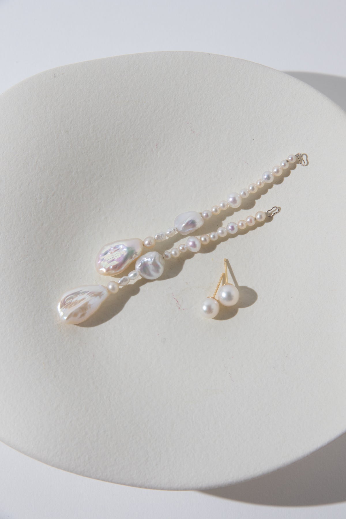Long Irregular white pearls Jacket structure earring.