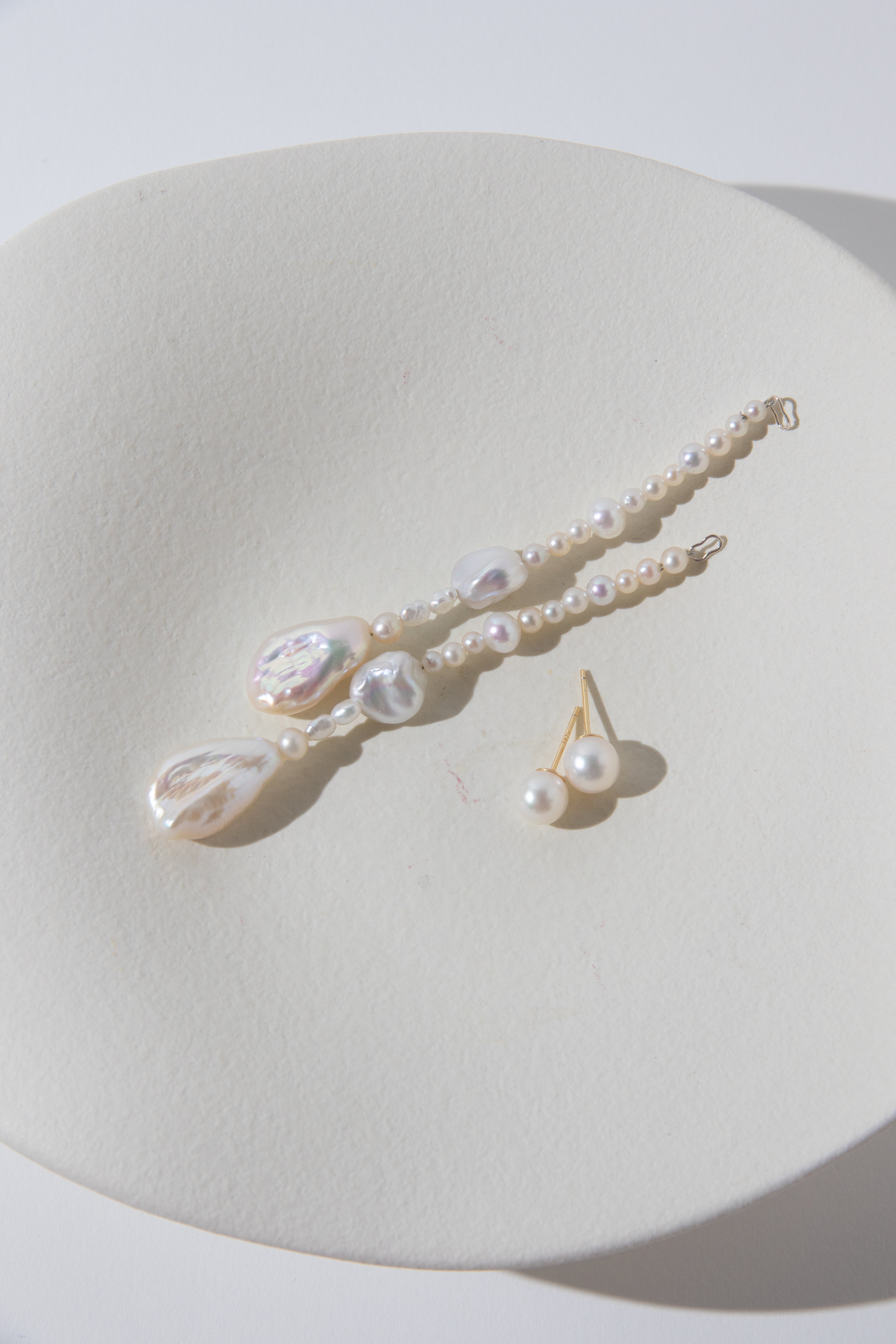 Long Irregular white pearls Jacket structure earring.