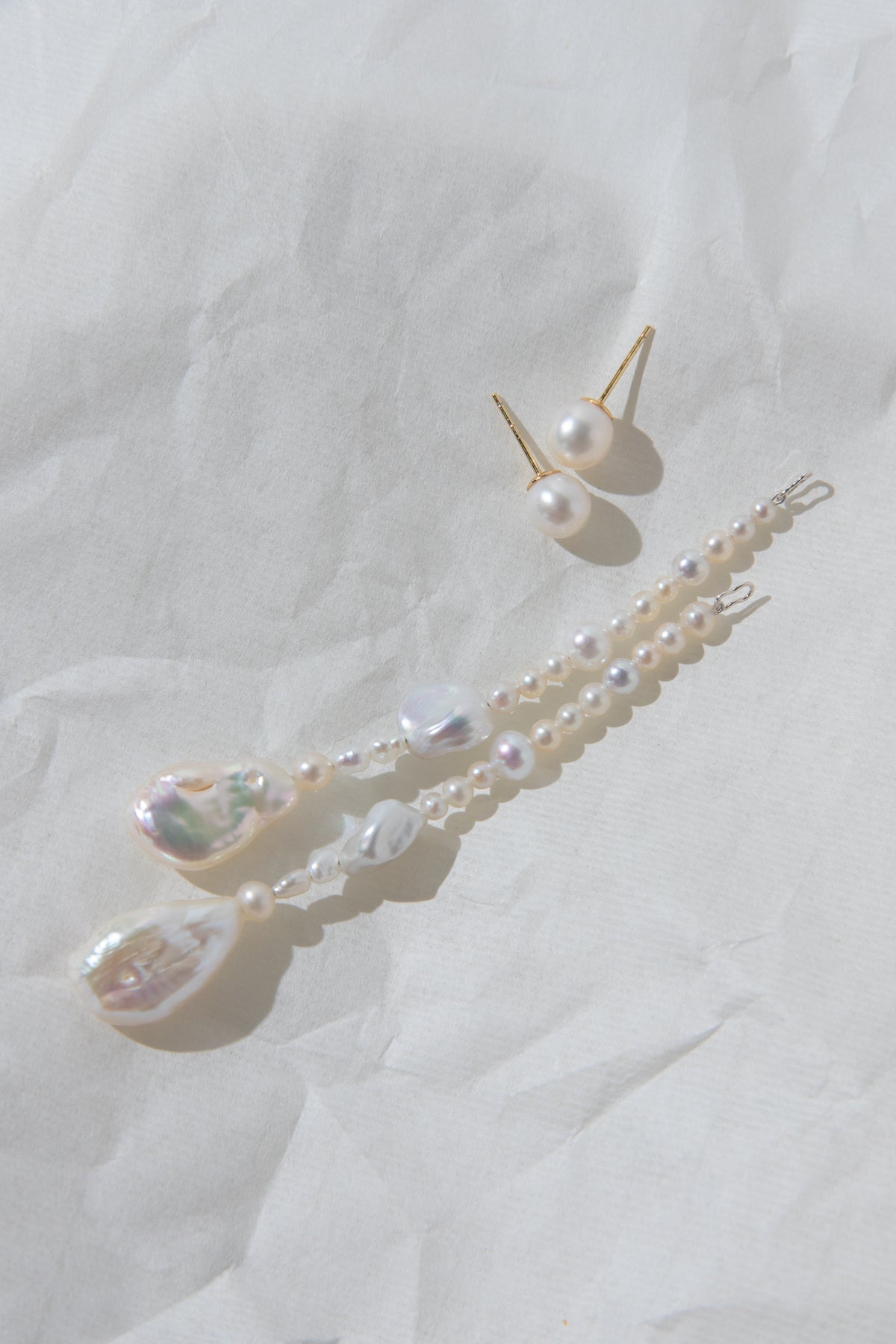 Long Irregular white pearls Jacket structure earring.