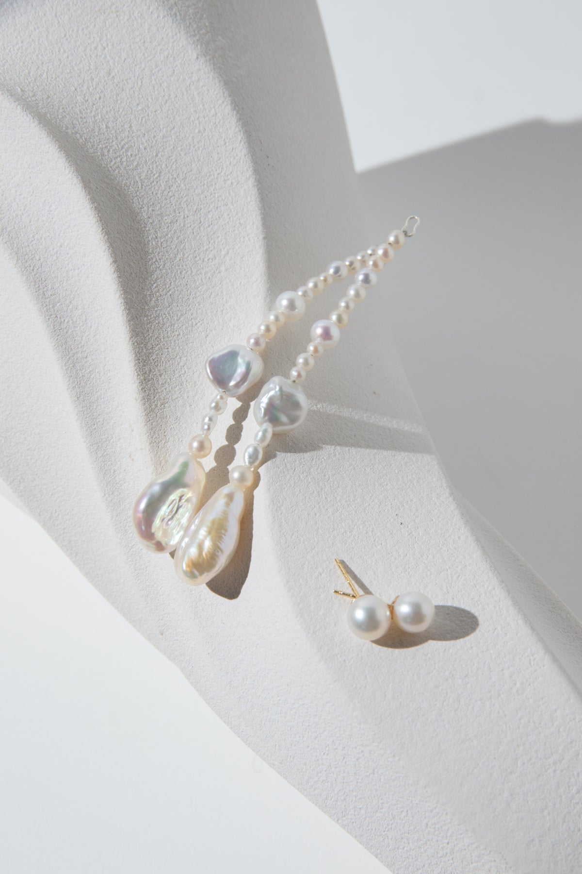 Long Irregular white pearls Jacket structure earring.