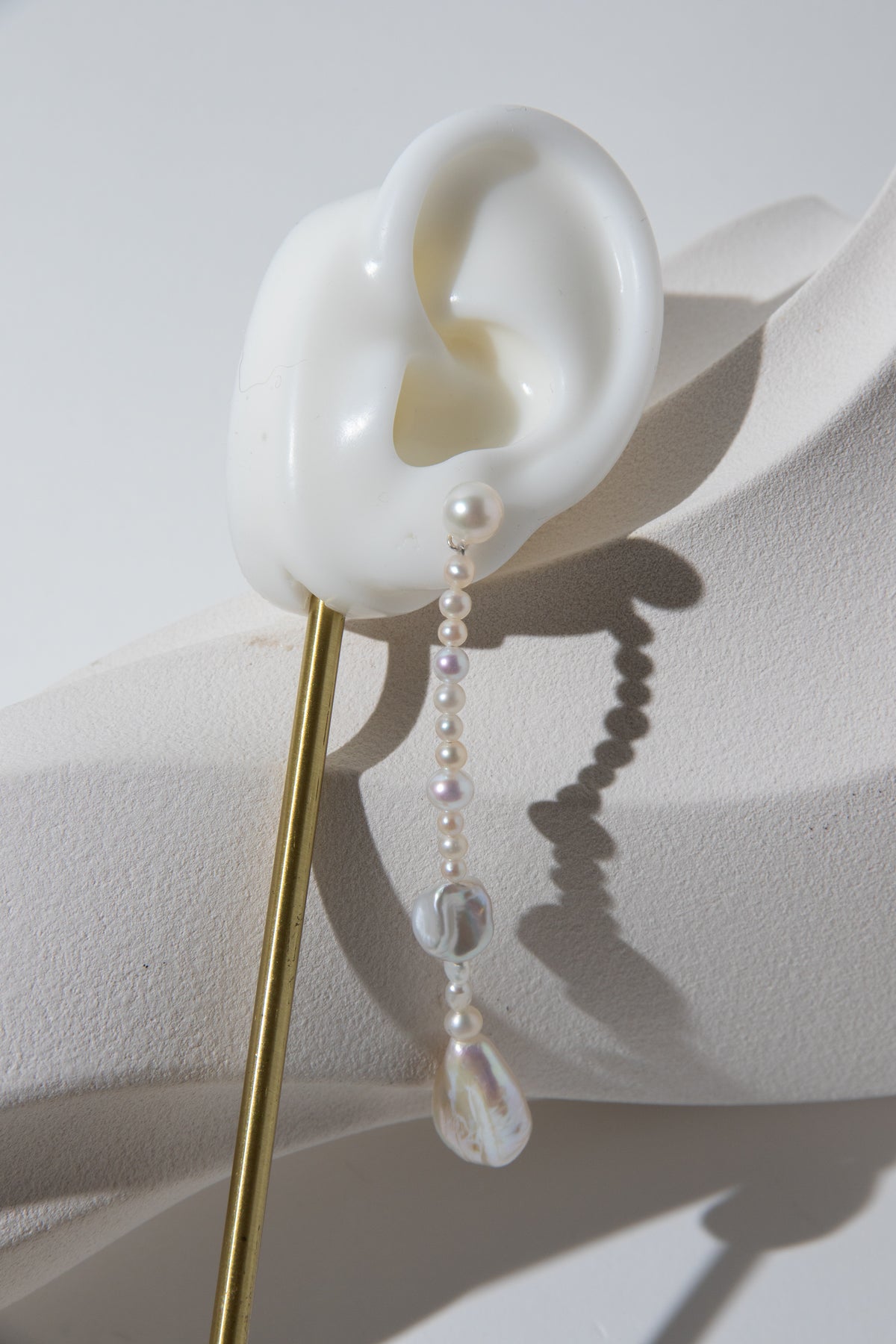 Long Irregular white pearls Jacket structure earring.