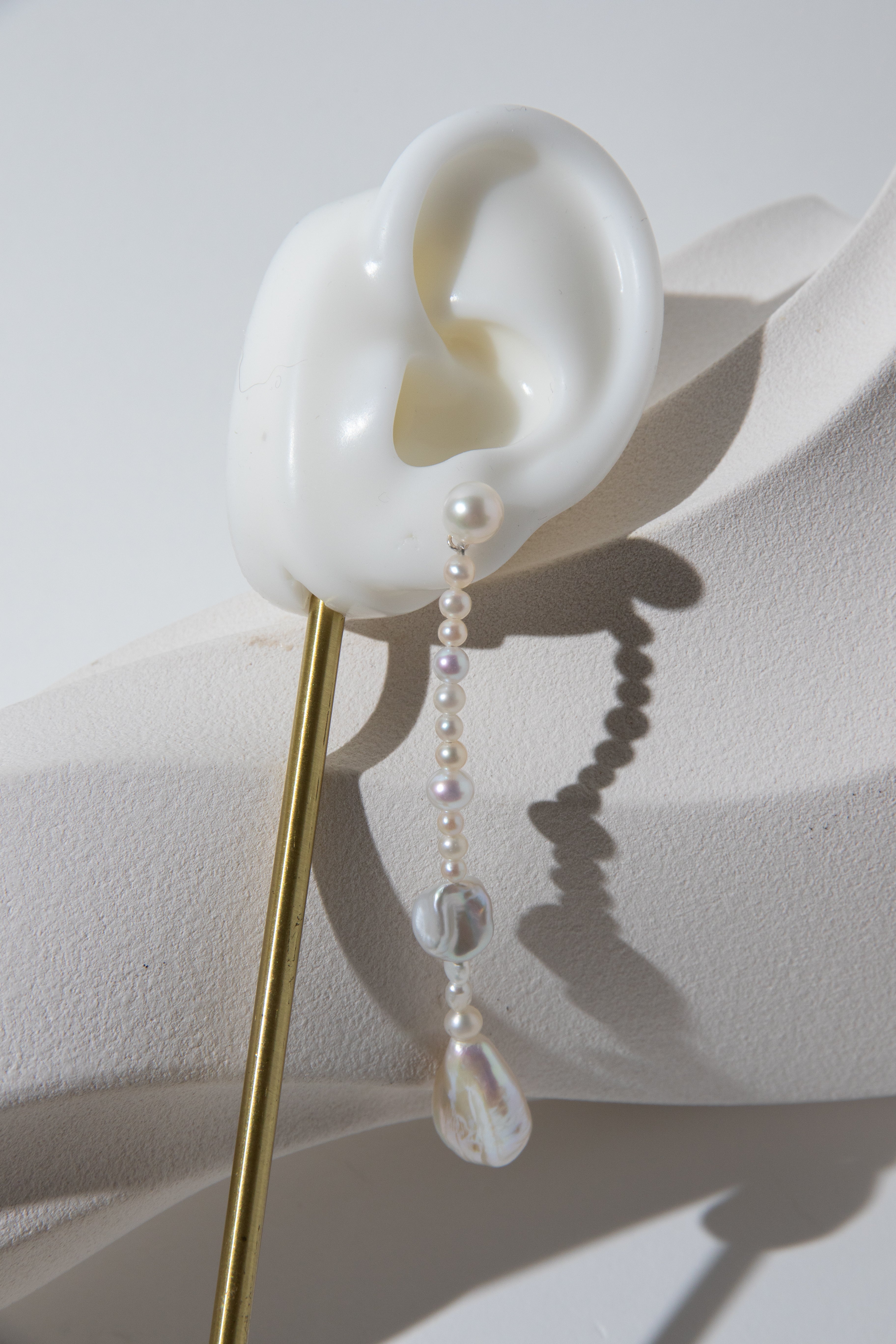 Long Irregular white pearls Jacket structure earring.