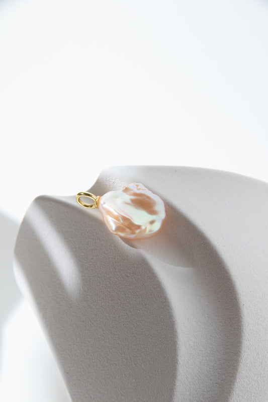 Watery sunset lake-natural orange pink colored thick seedless petal pearl pendant.