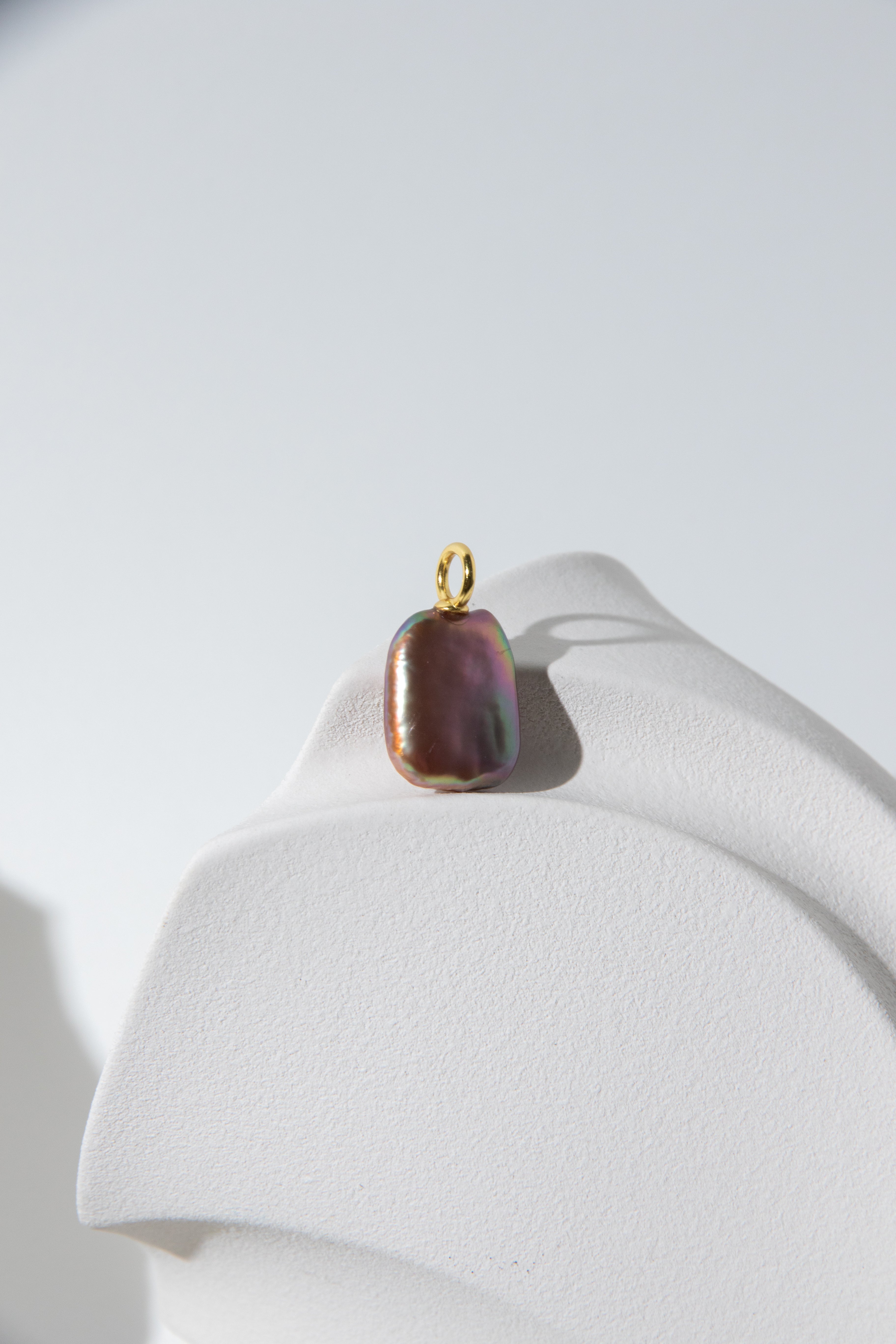 Strong thick brown based vivid green and purple square pearl pendant.