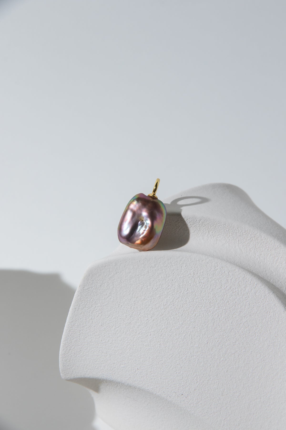 Strong thick brown based vivid green and purple square pearl pendant.