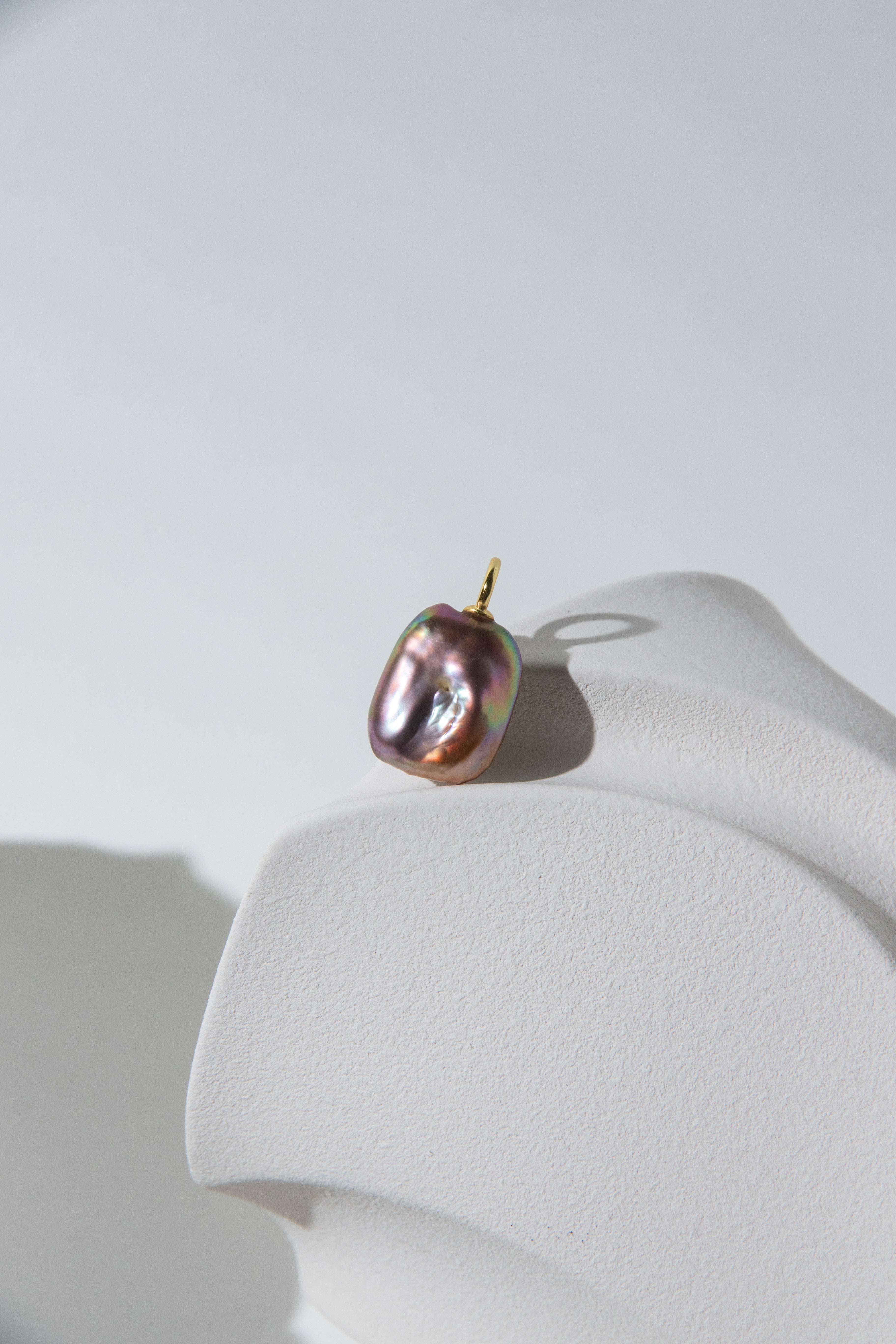 Strong thick brown based vivid green and purple square pearl pendant.