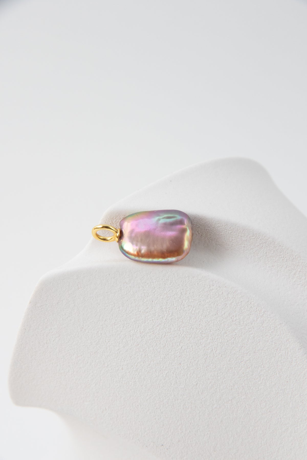 Strong thick brown based vivid green and purple square pearl pendant.