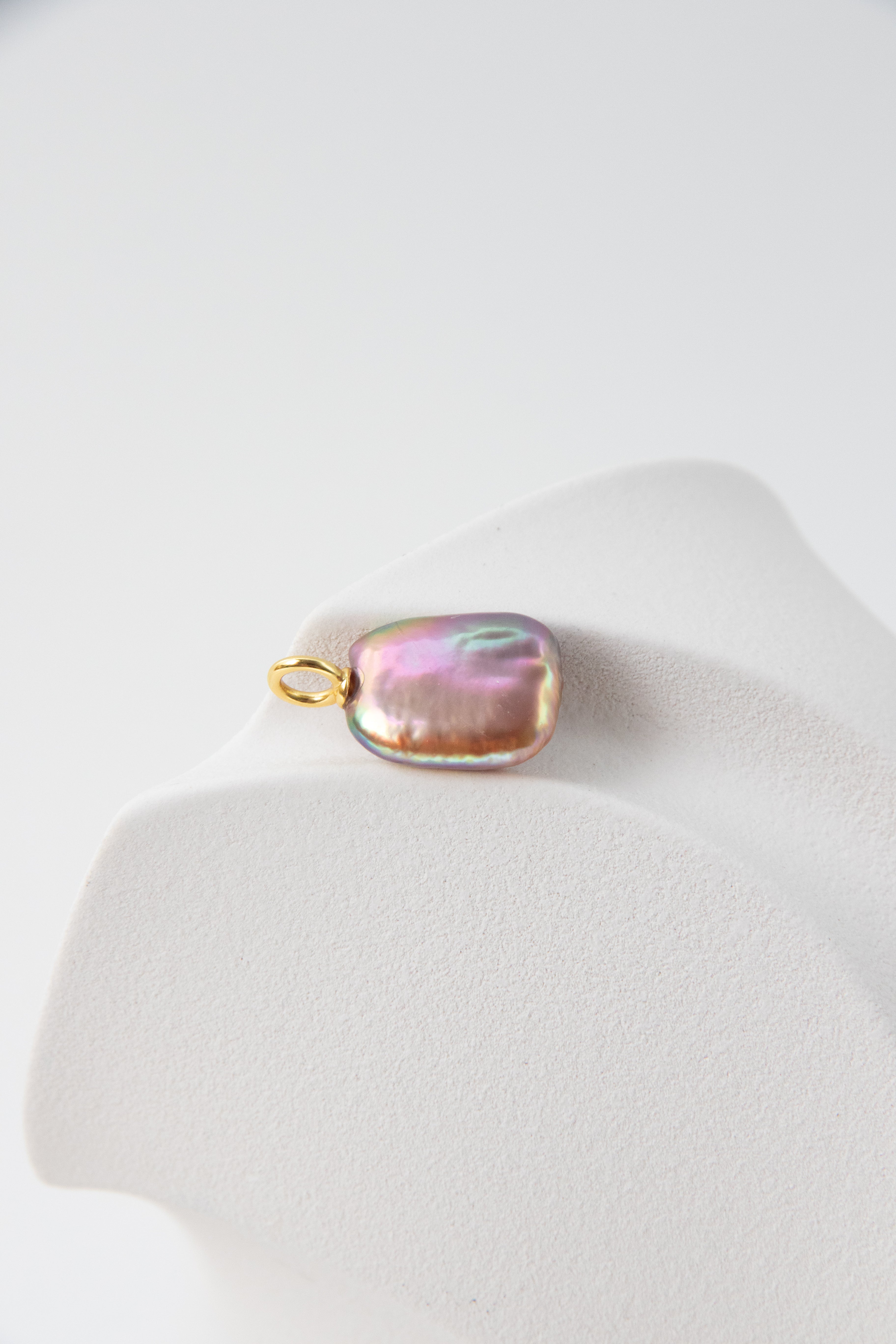 Strong thick brown based vivid green and purple square pearl pendant.