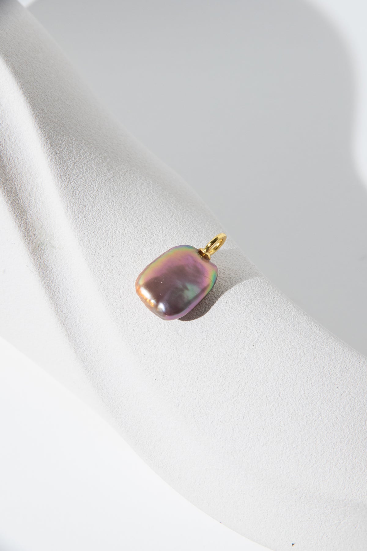 Strong thick brown based vivid green and purple square pearl pendant.