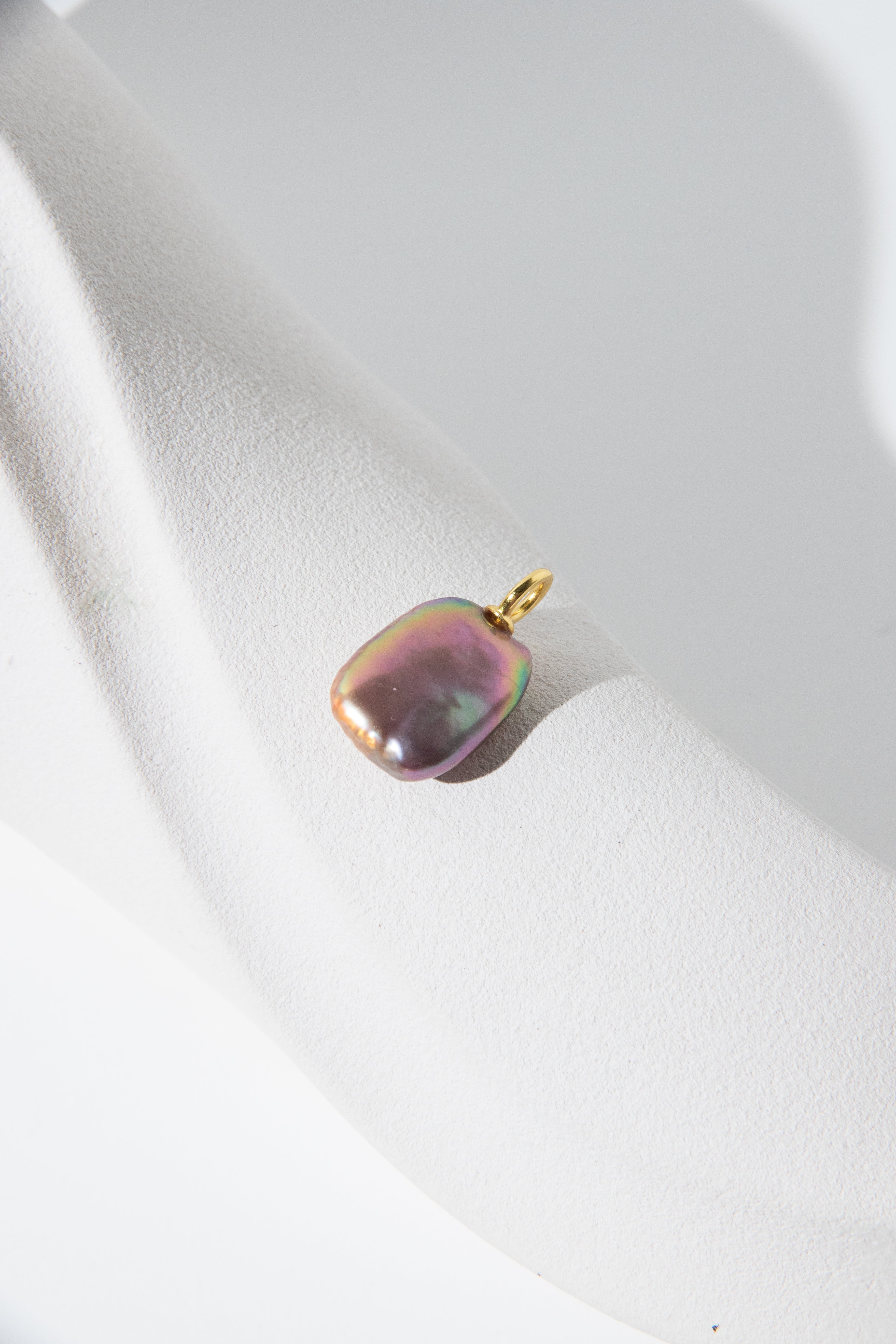Strong thick brown based vivid green and purple square pearl pendant.