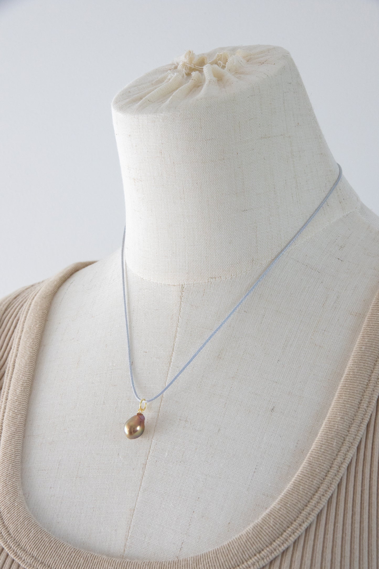 Small shiny metallic avocado pearl pendant