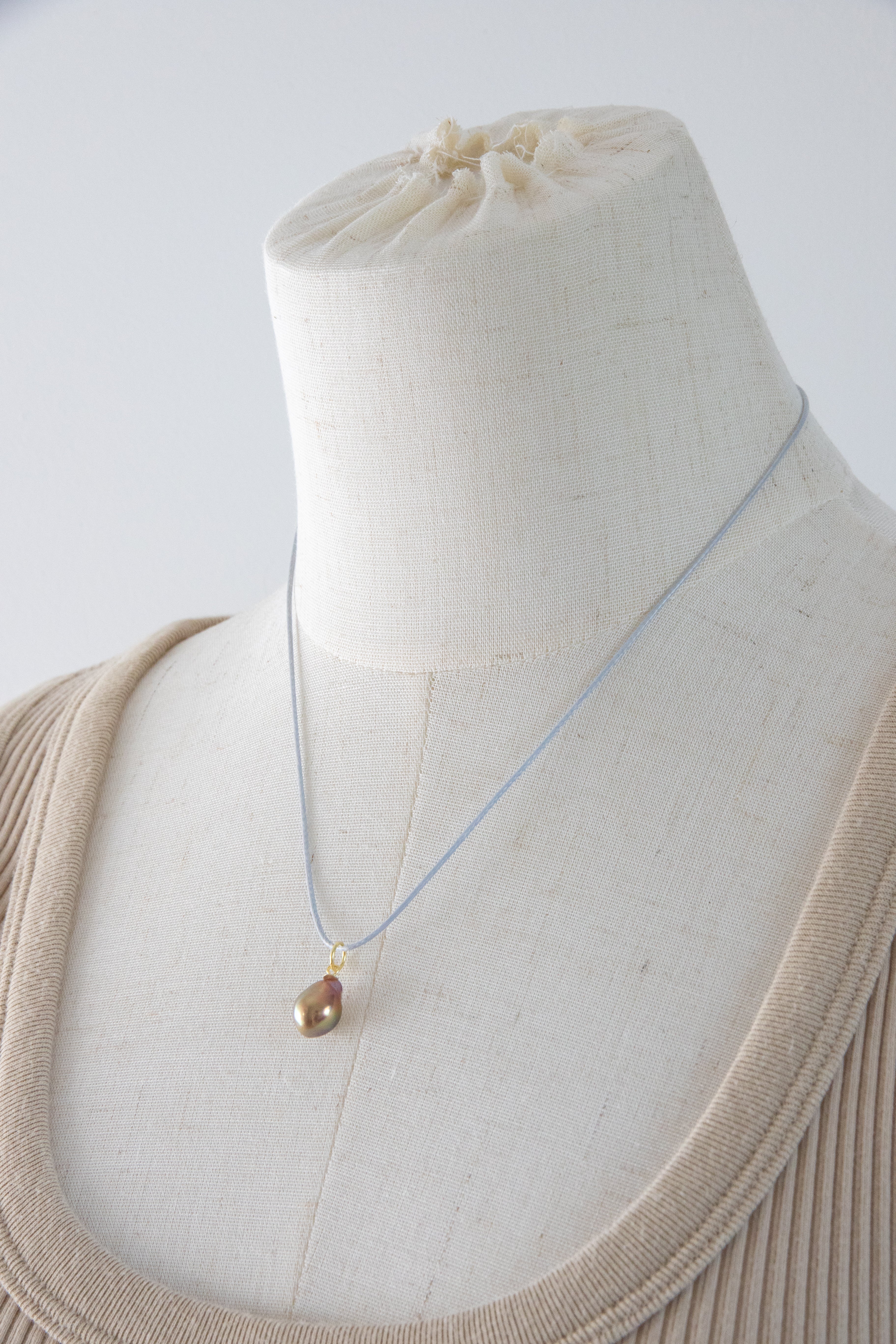 Small shiny metallic avocado pearl pendant