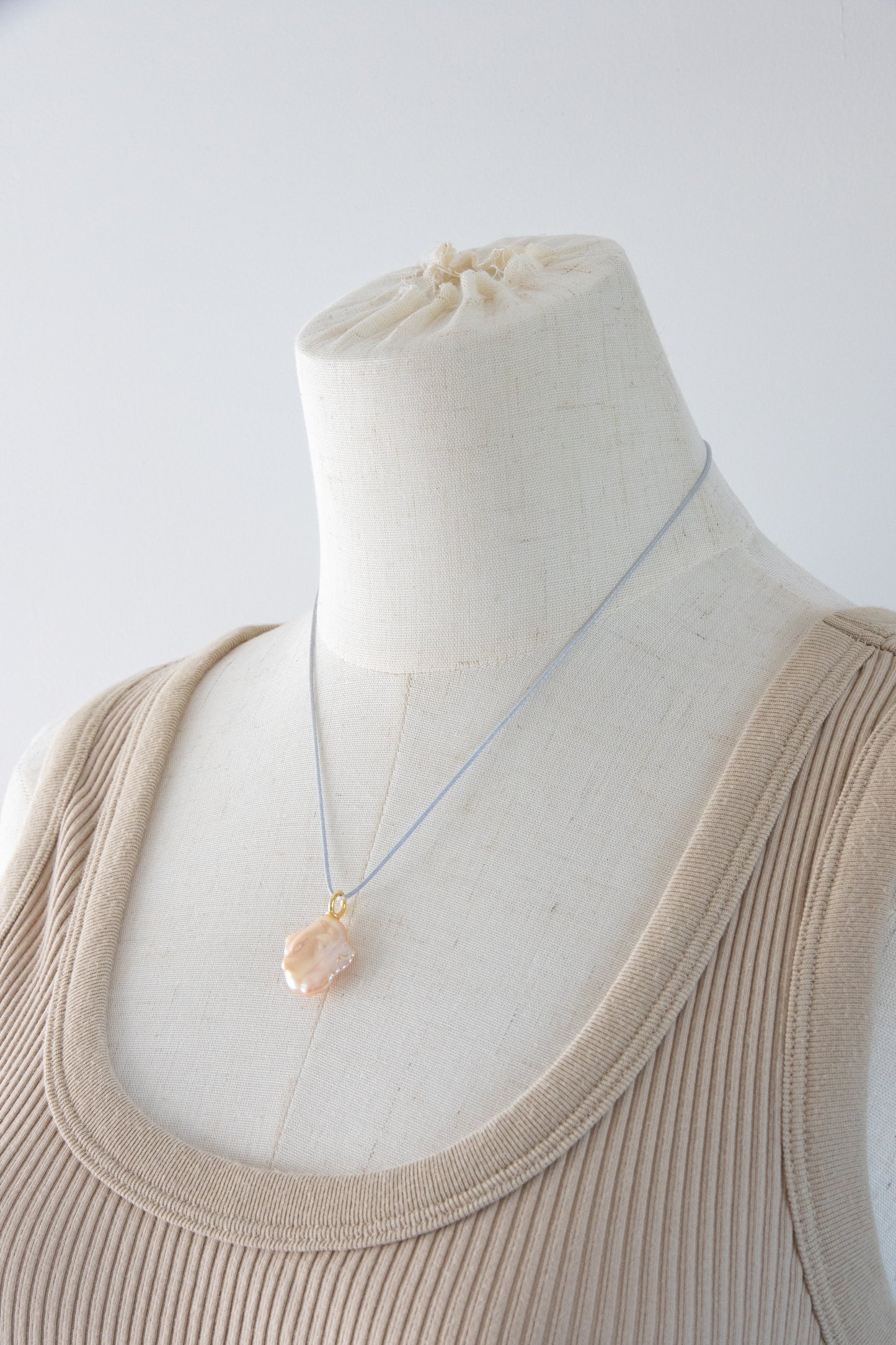 Watery sunset lake-natural orange pink colored thick seedless petal pearl pendant.