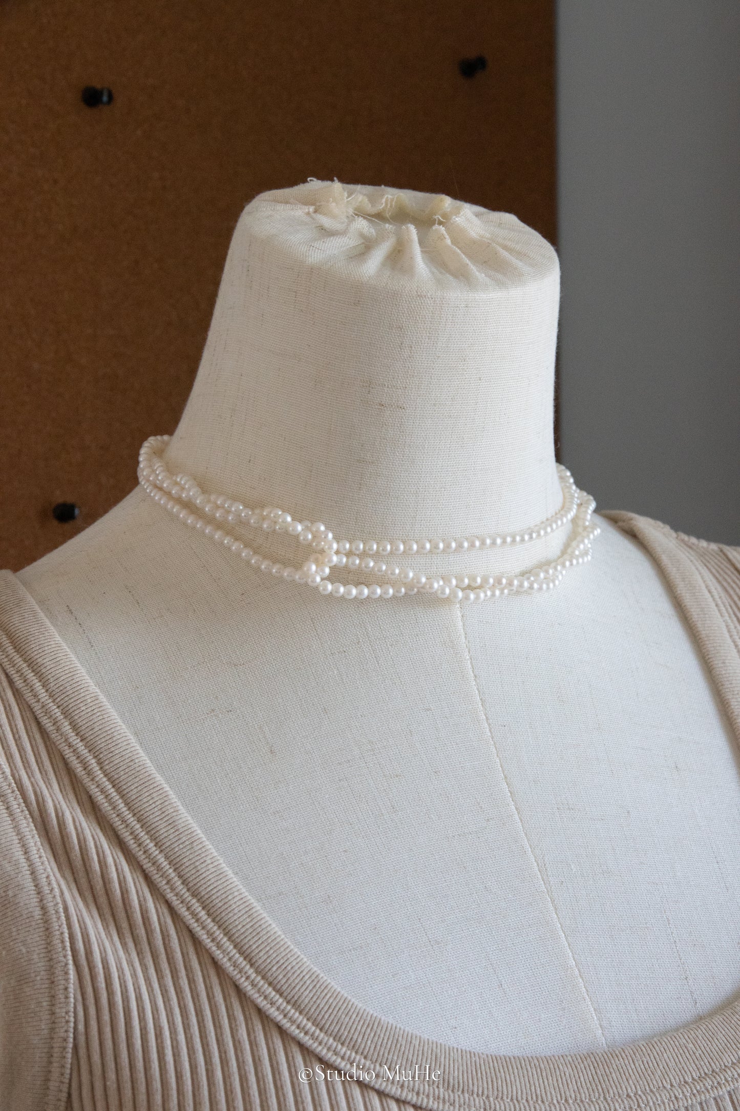 1.2 meters long necklace with small round white pearls.