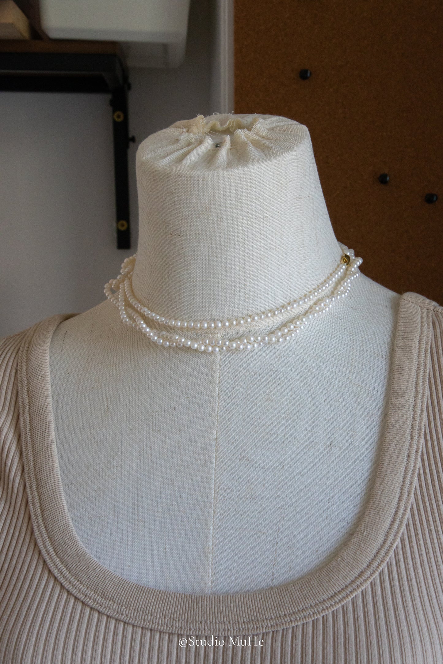 1.2 meters long necklace with small round white pearls.