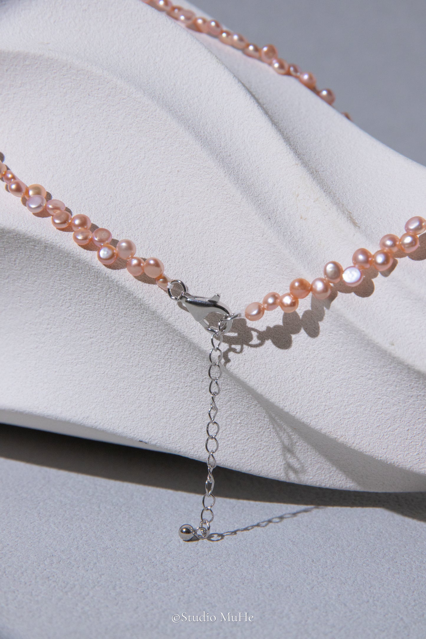 Floral peach- mini seedless flat round peach toned pink pearl necklace