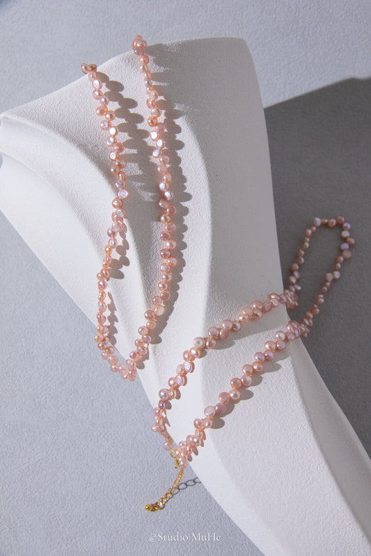 Floral peach- mini seedless flat round peach toned pink pearl necklace