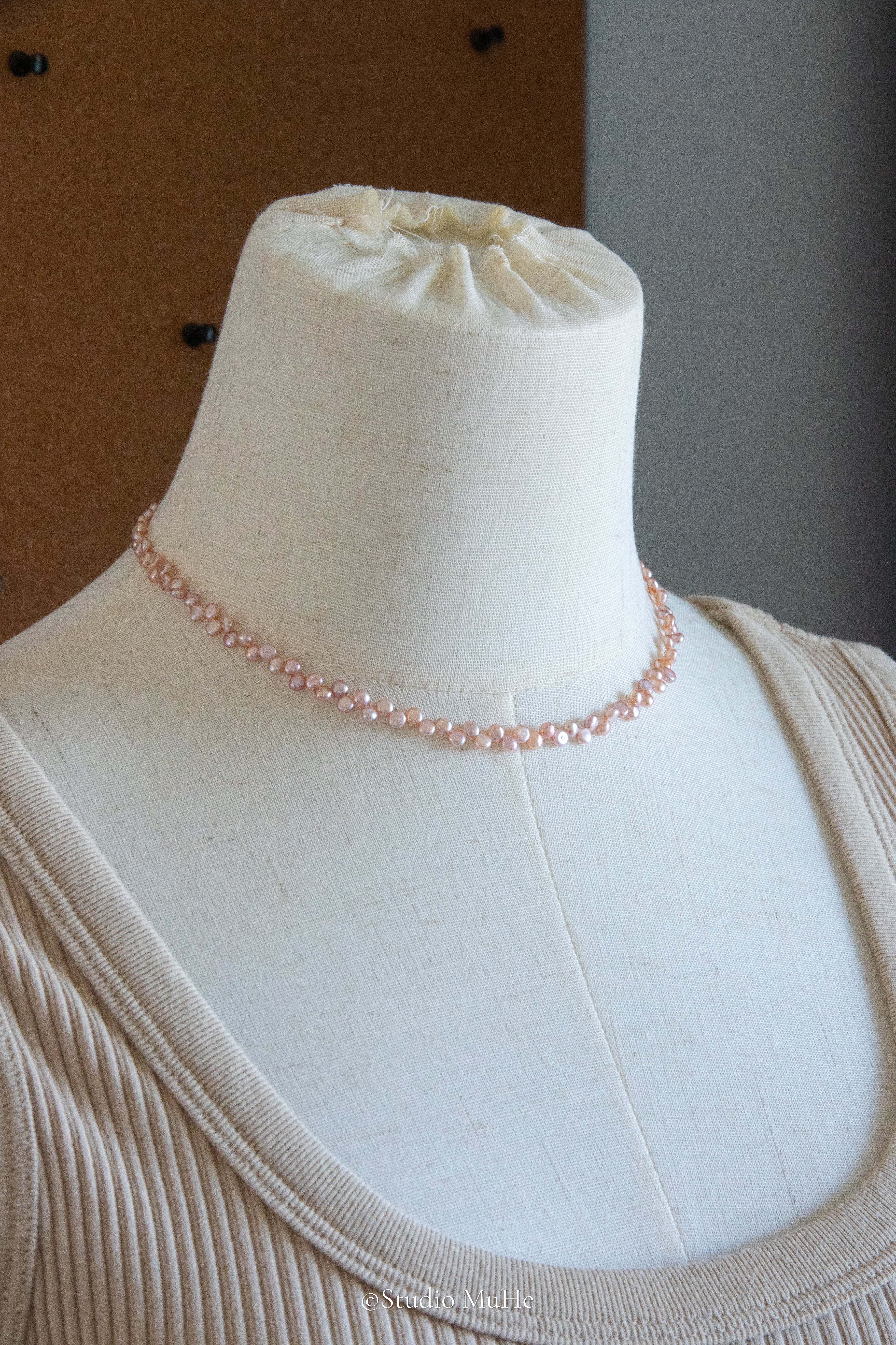 Floral peach- mini seedless flat round peach toned pink pearl necklace