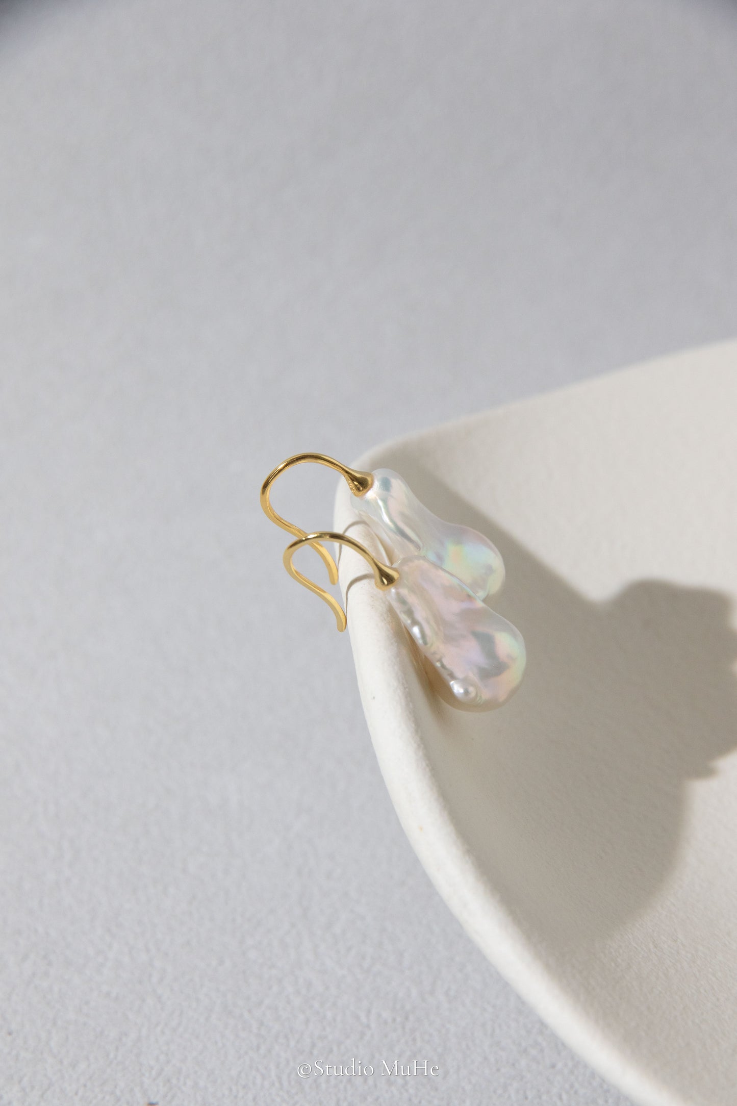 Medium sized flawless white baroque pearl earrings.