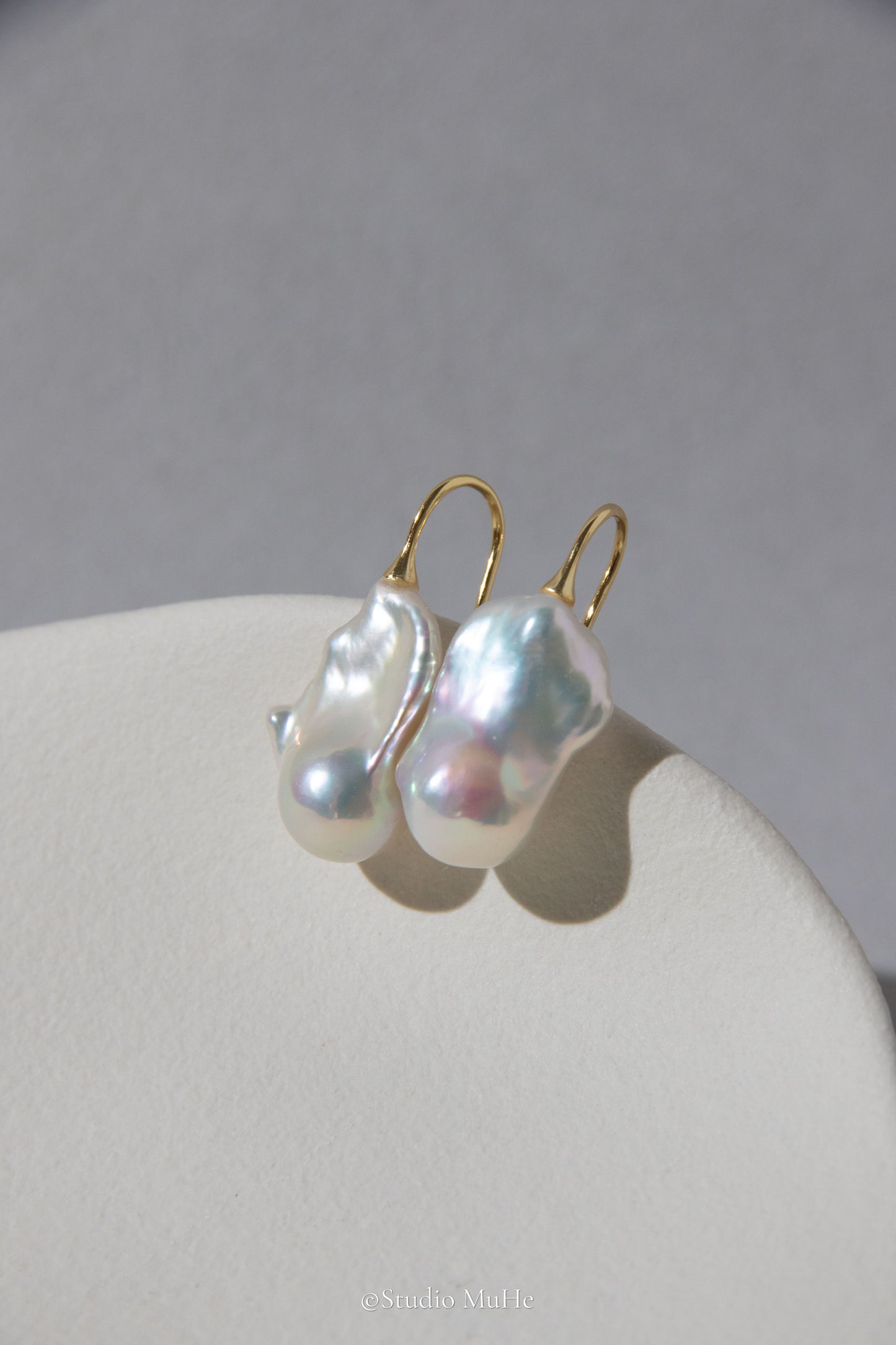 Medium sized flawless white baroque pearl earrings.