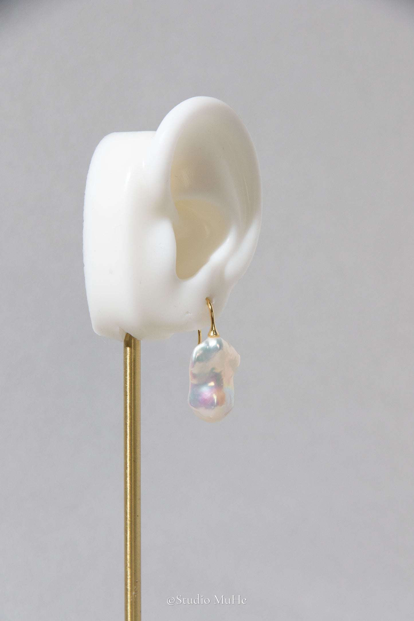 Medium sized flawless white baroque pearl earrings.