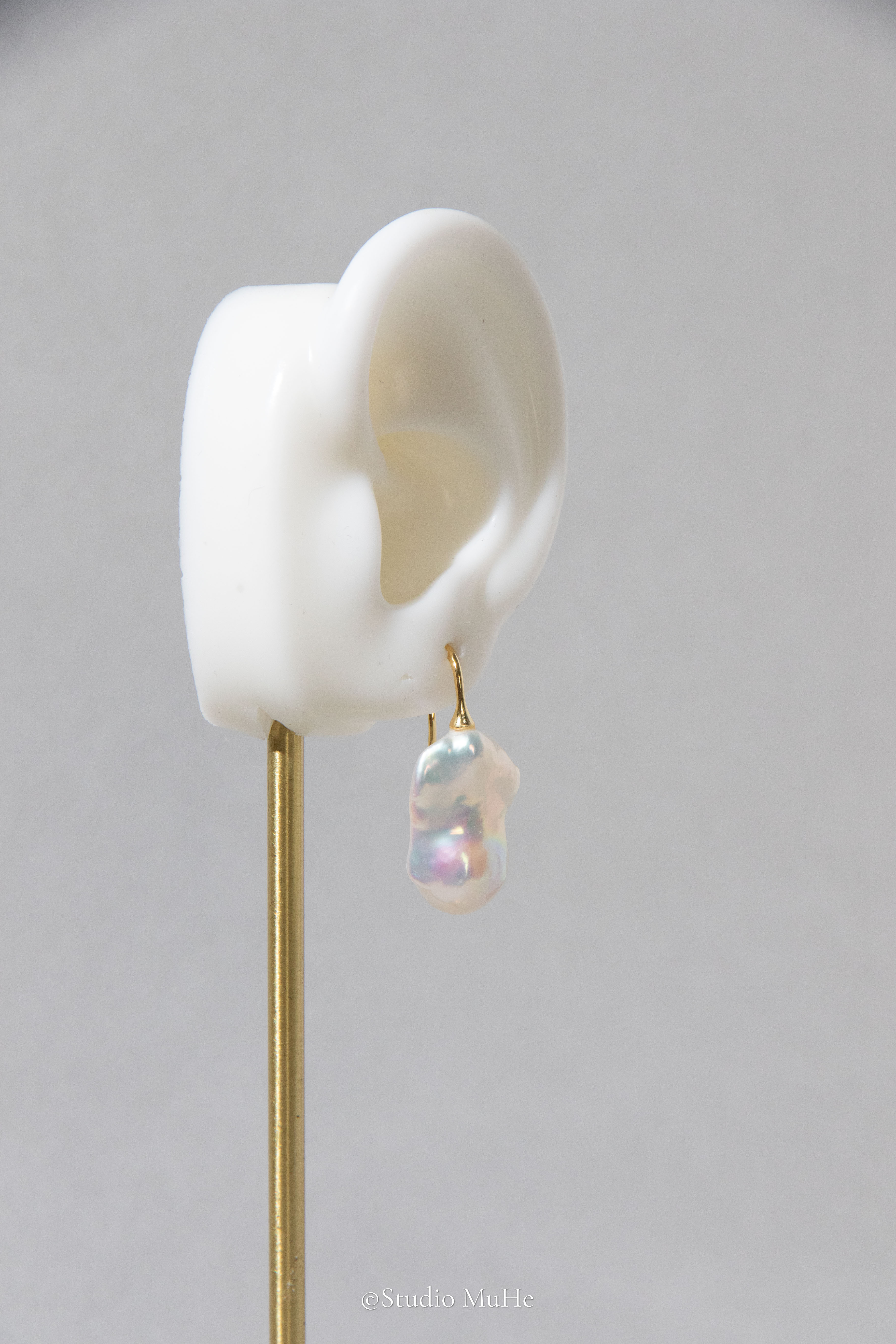 Medium sized flawless white baroque pearl earrings.