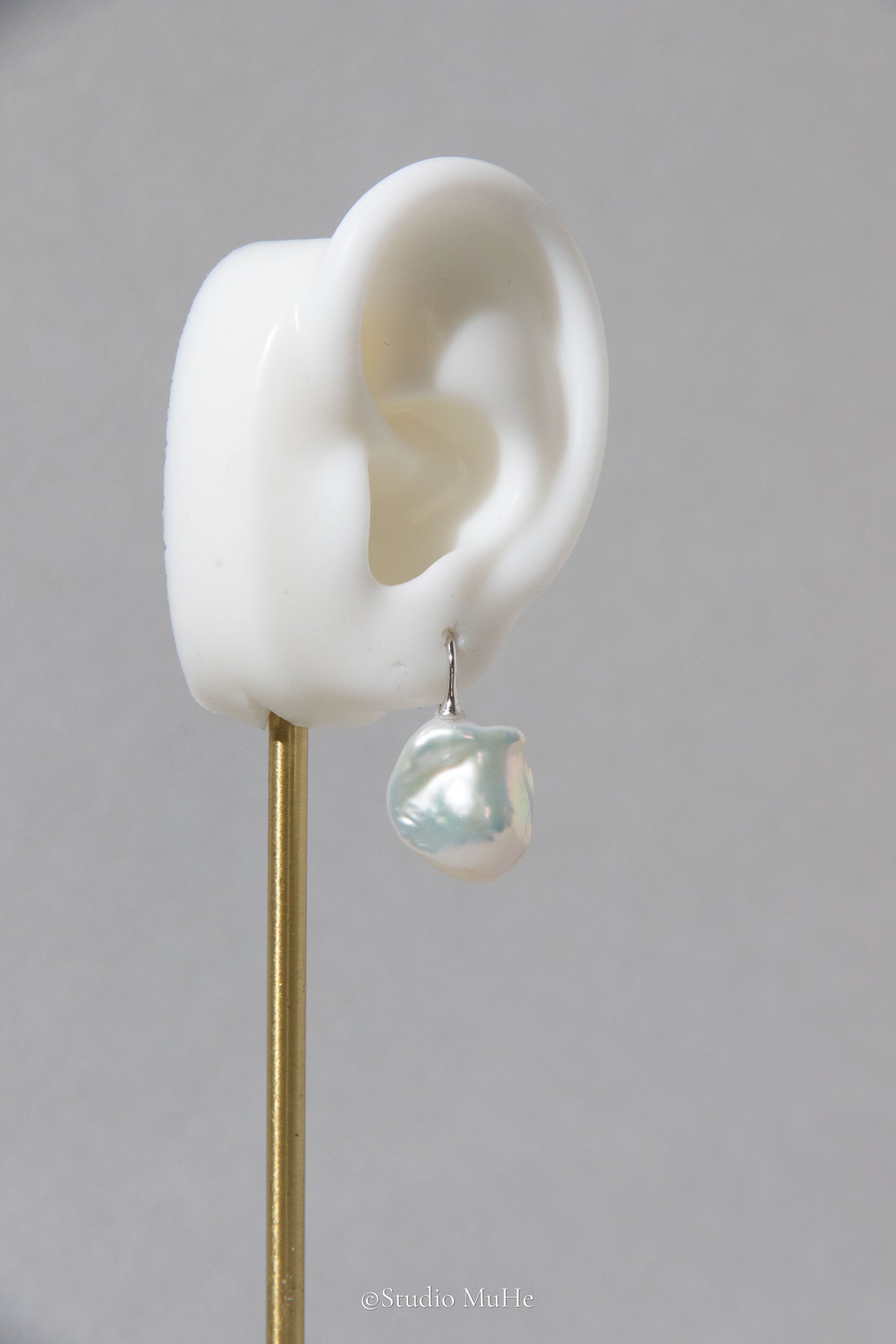 Medium sized flawless white baroque pearl earrings.
