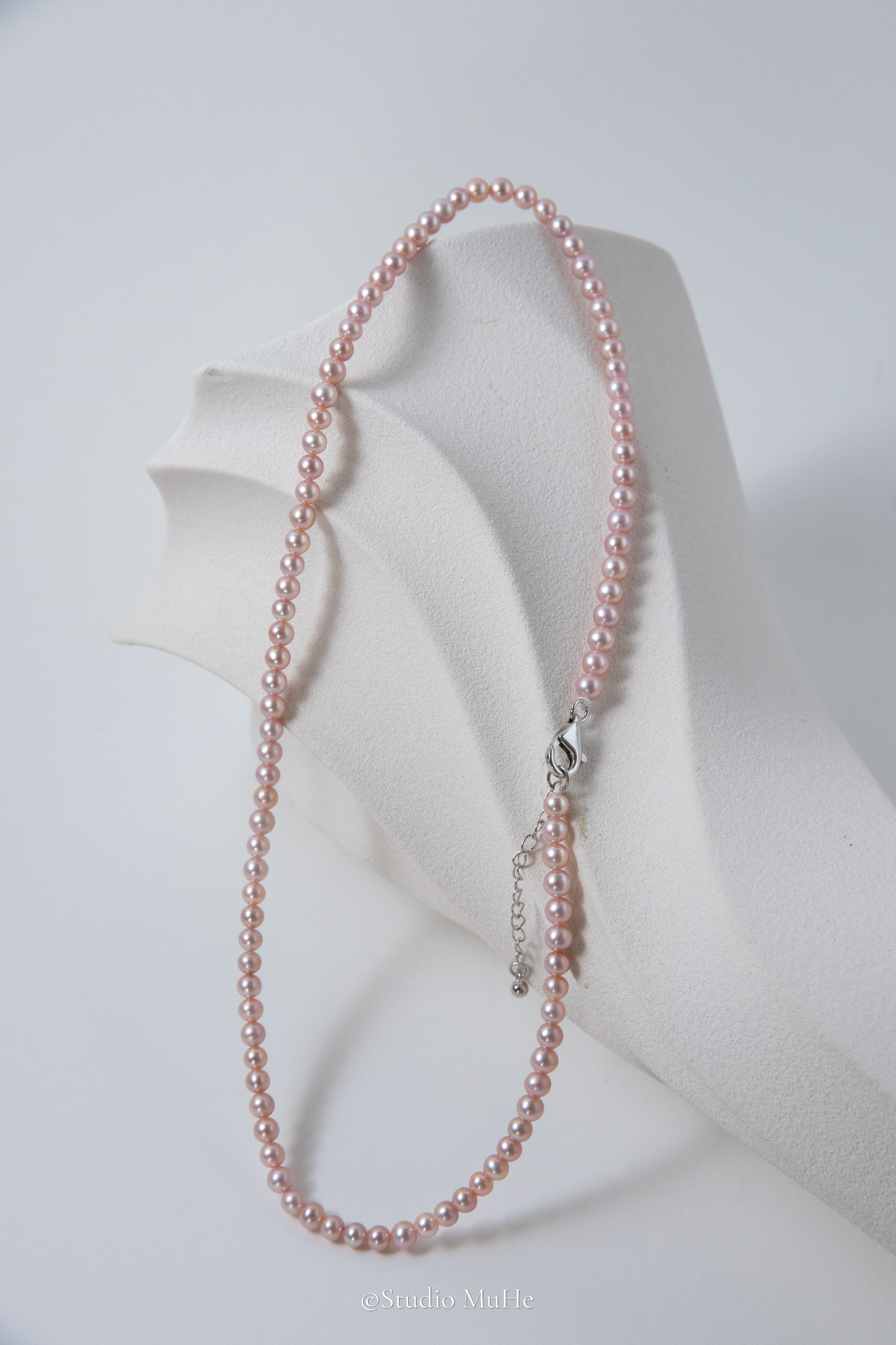Summer Peach-Excellent level light peach colored flawless small round seedless pearls necklace