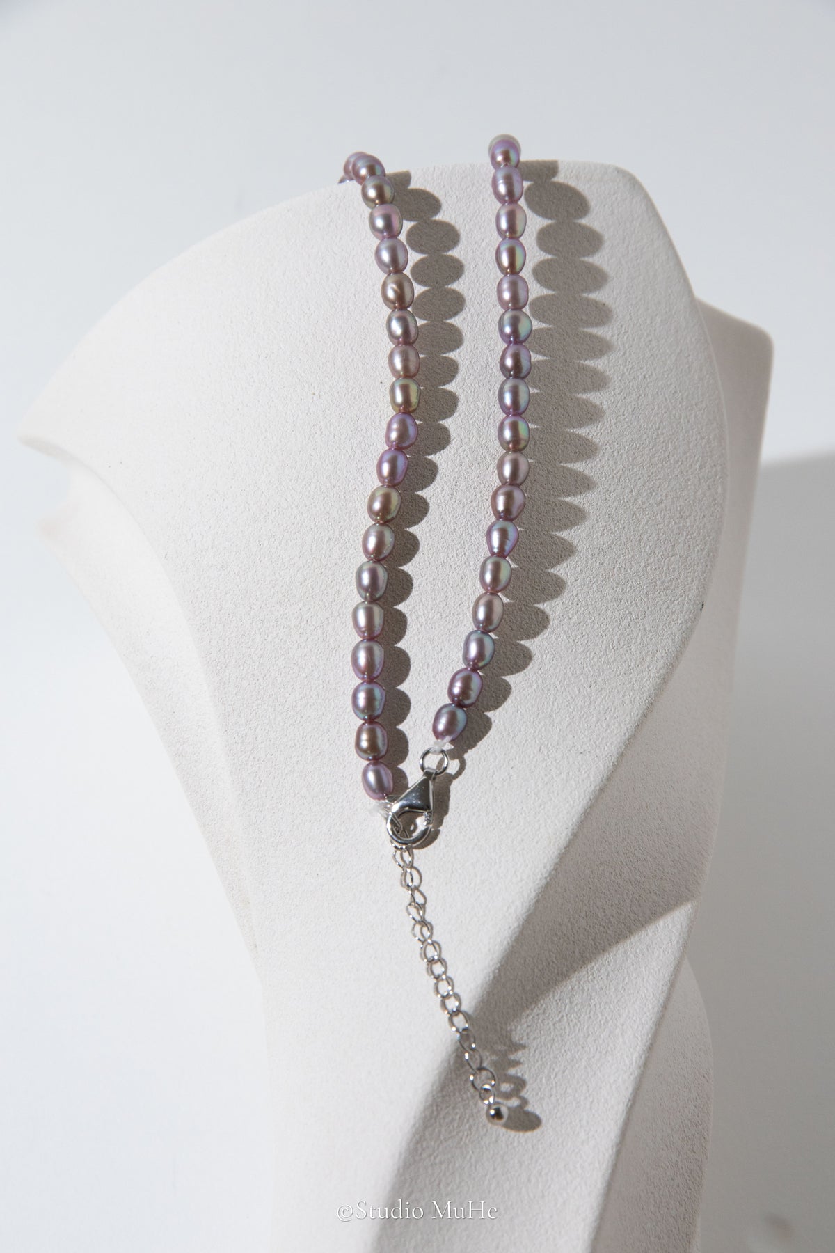 entry level metallic purple and green colored rice pearls necklace
