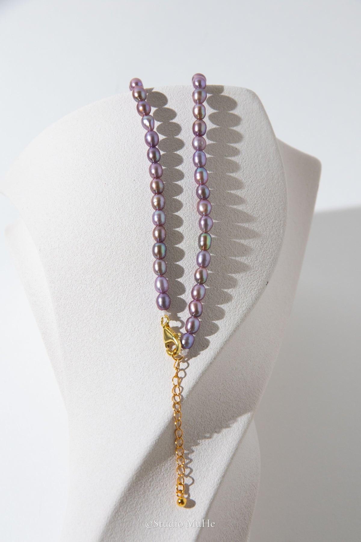 entry level metallic purple and green colored rice pearls necklace